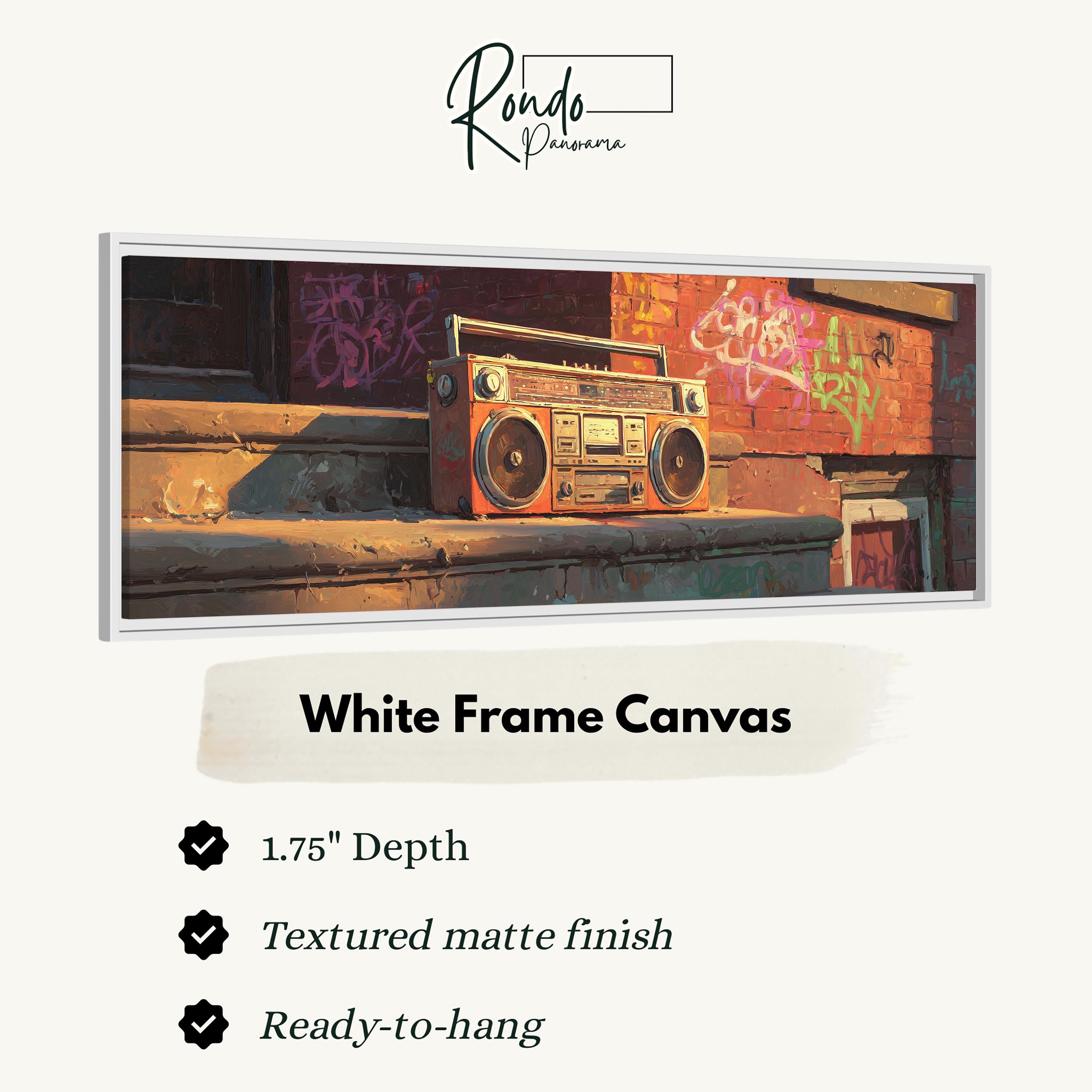 a white frame canvas with a vintage-style radio on a ledge, set against a backdrop of graffiti on a brick wall.
