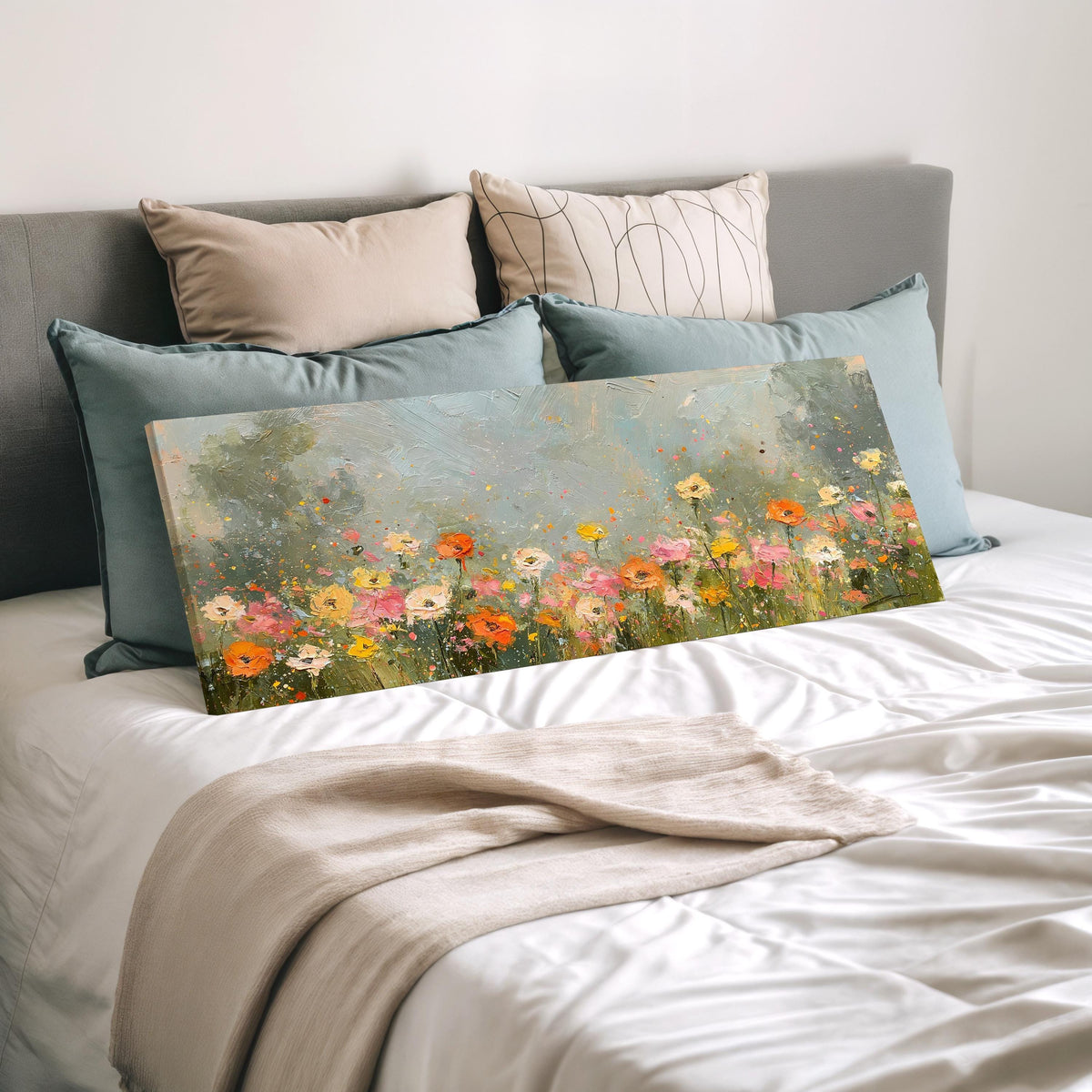 Impressionist wildflower meadow wide panoramic canvas print laid on a bed to show its size