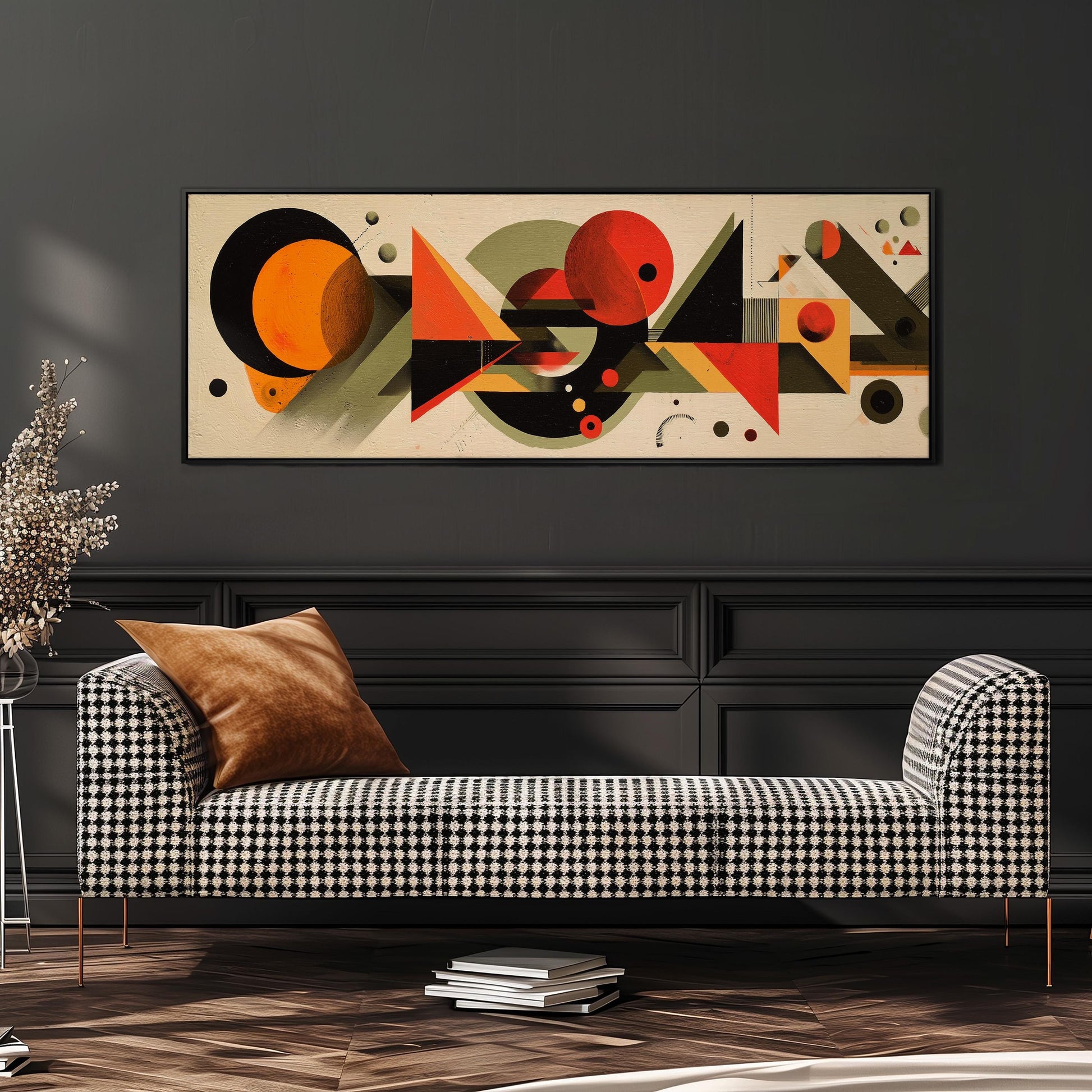a modern living room with a black and white checkered sofa, a stack of books, and a large abstract painting hanging on the wall above the sofa.