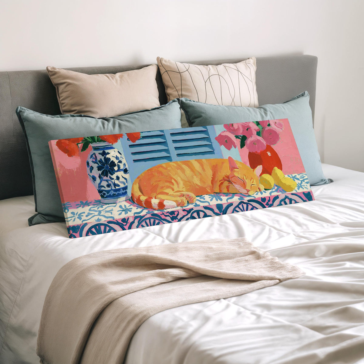 Orange cat napping on a tiled table wide panoramic canvas print laid on a bed to show its size