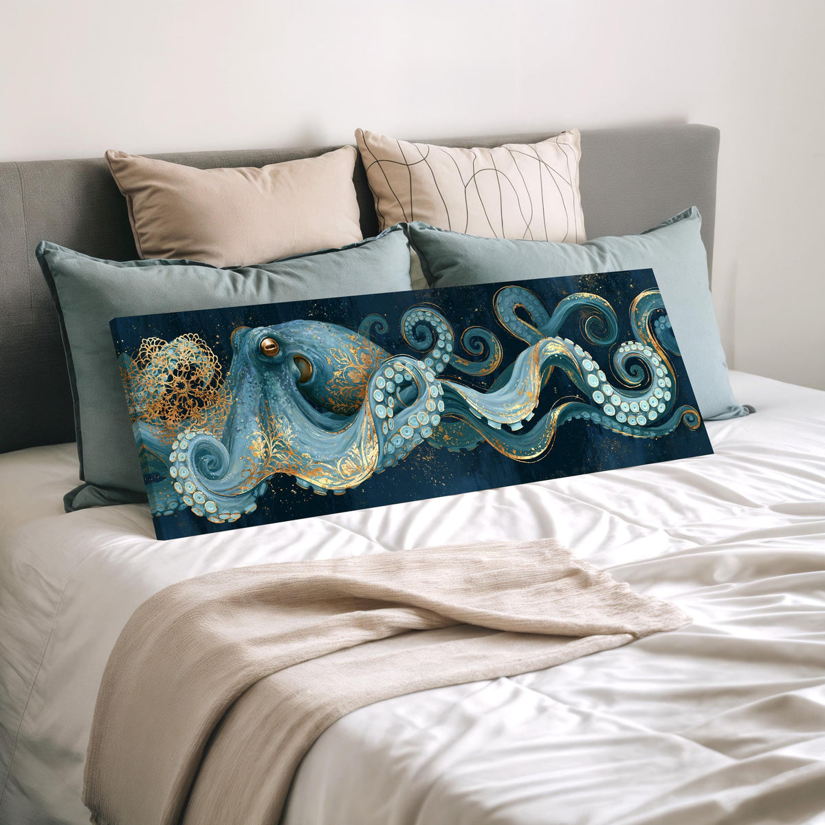 Blue and gold octopus wide panoramic canvas print laid on a bed to show its size