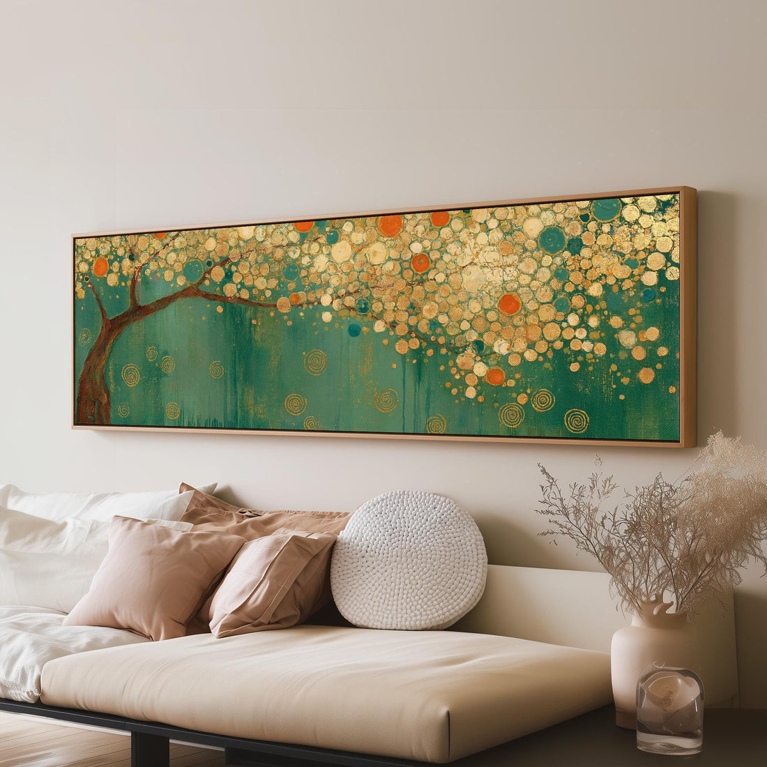Klimt style tree with golden circles on teal long horizontal canvas print above a sofa in a living room