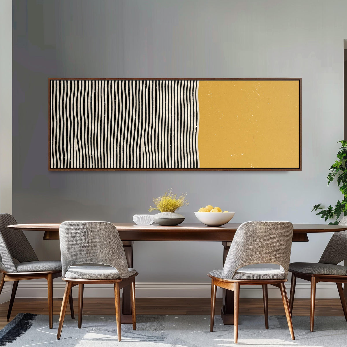Black wavy stripes beside a mustard block long horizontal canvas print above a dining table