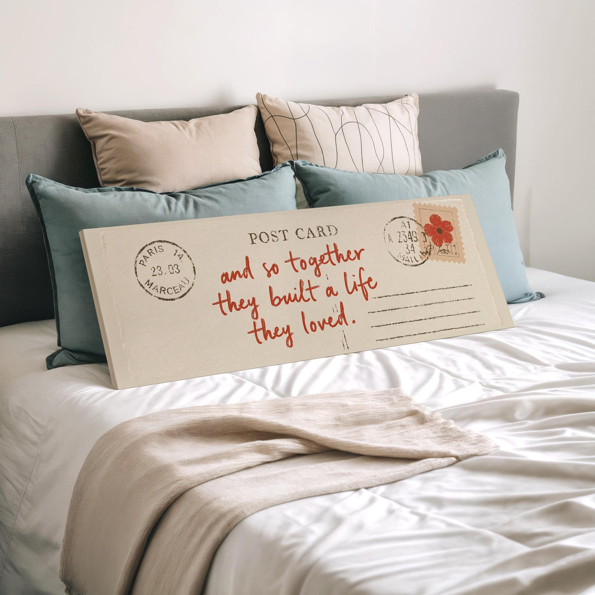 Paris postcard saying and so together they built a life they loved wide panoramic canvas print laid on a bed to show its size