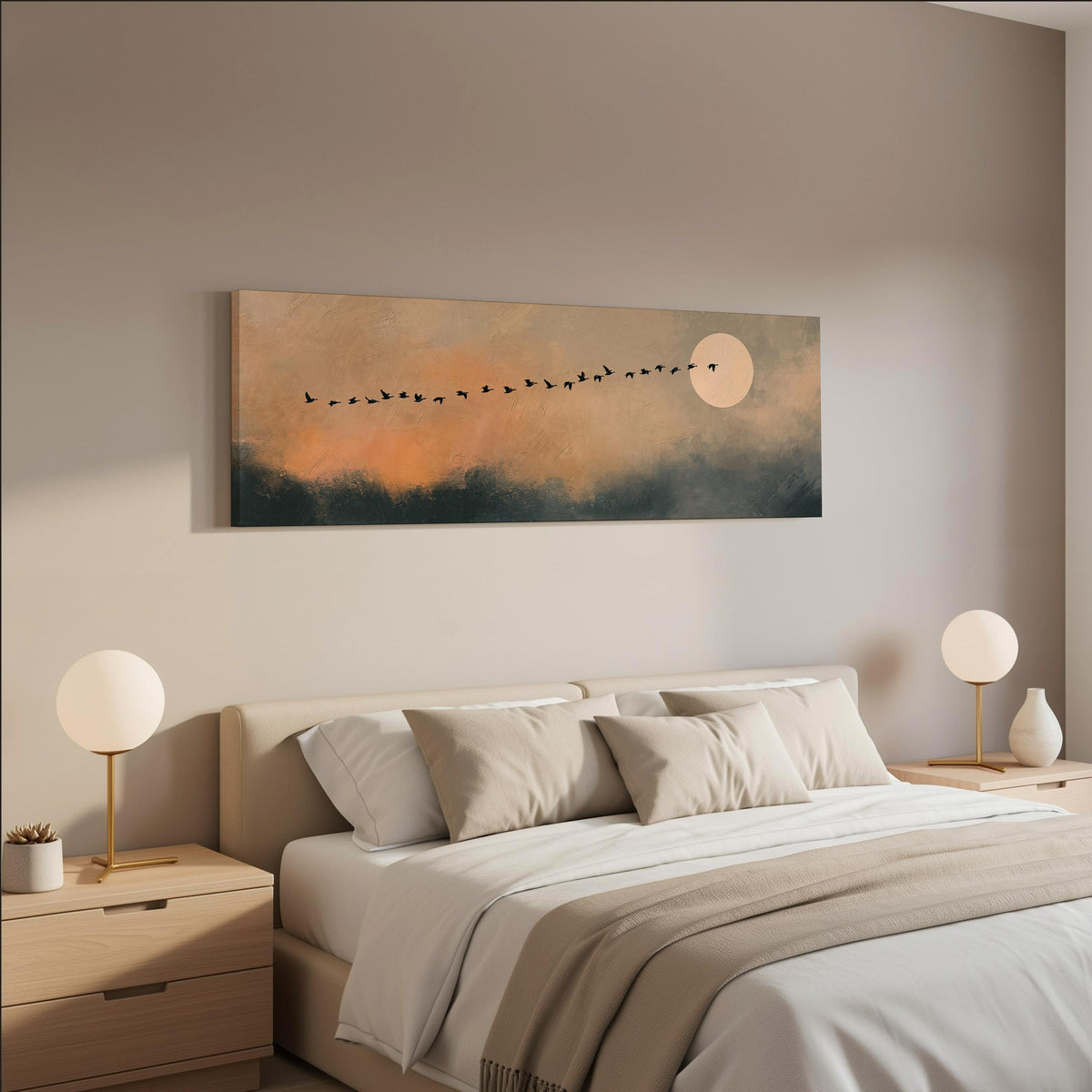 Migrating birds passing a moon at peach dusk wide panoramic canvas print above a bed in a neutral bedroom