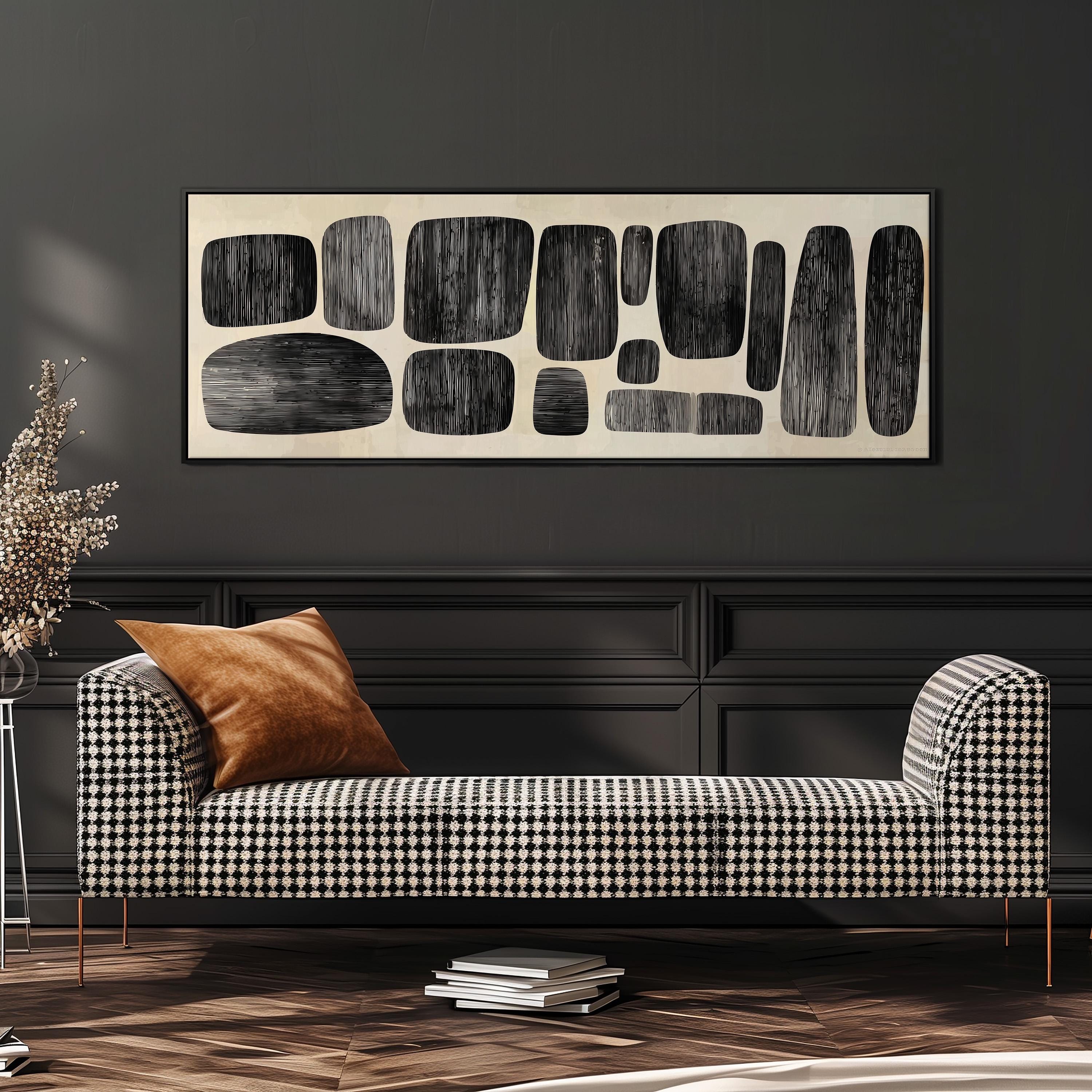 a modern living room with a black and white checkered sofa, a stack of books, and a large abstract art piece on the wall.