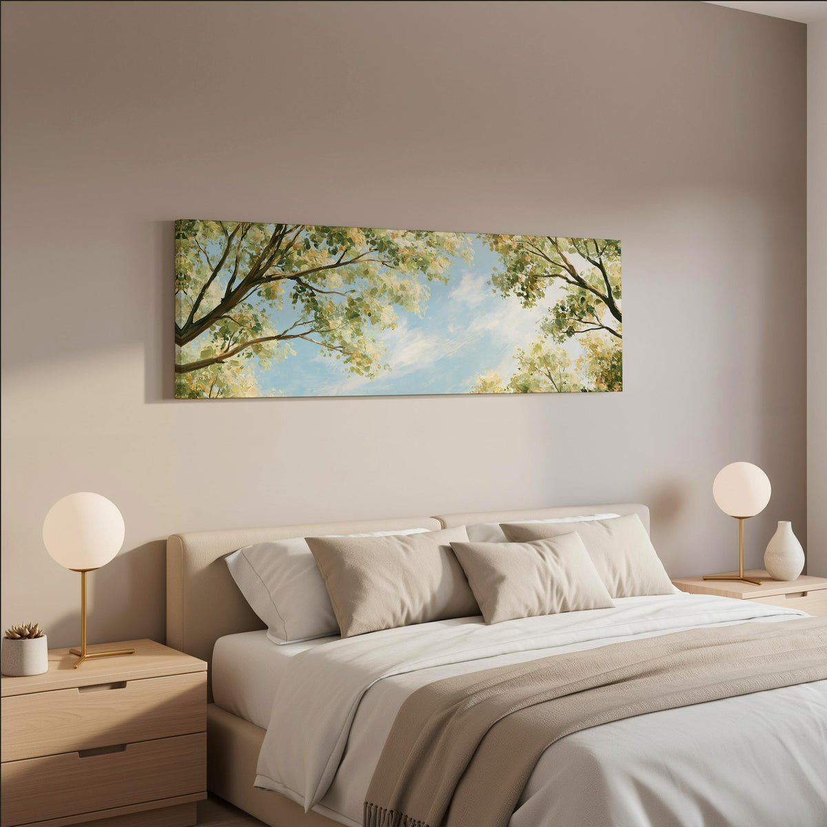 Sunlit leafy branches framing soft clouds wide panoramic canvas print above a bed in a neutral bedroom