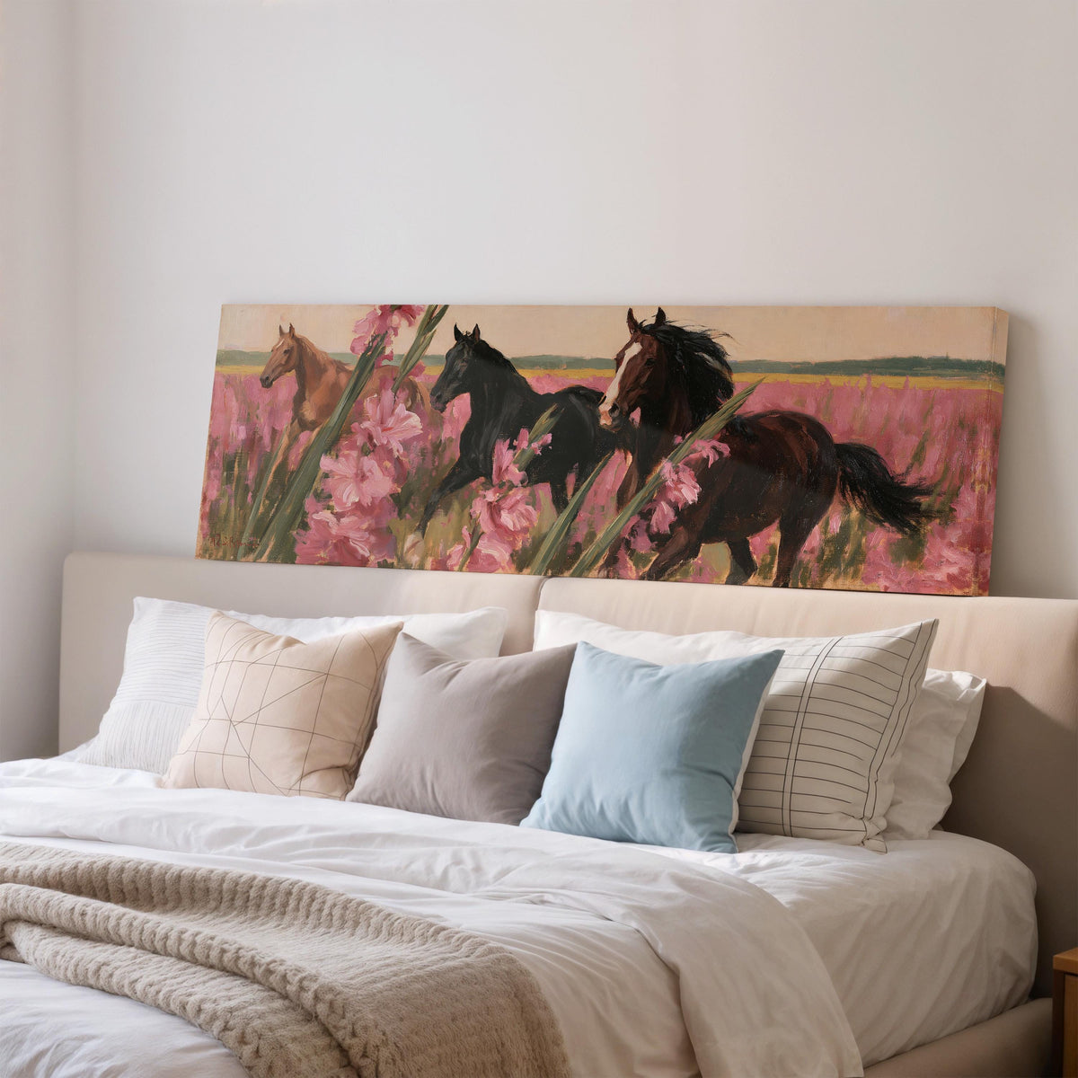 Horses running through pink gladiolus wide panoramic canvas print above a bed in a bedroom