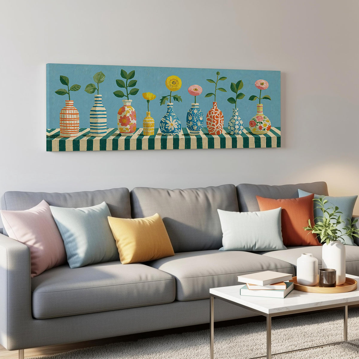 Row of striped vases with flowers panoramic canvas print above a grey sofa in a living room