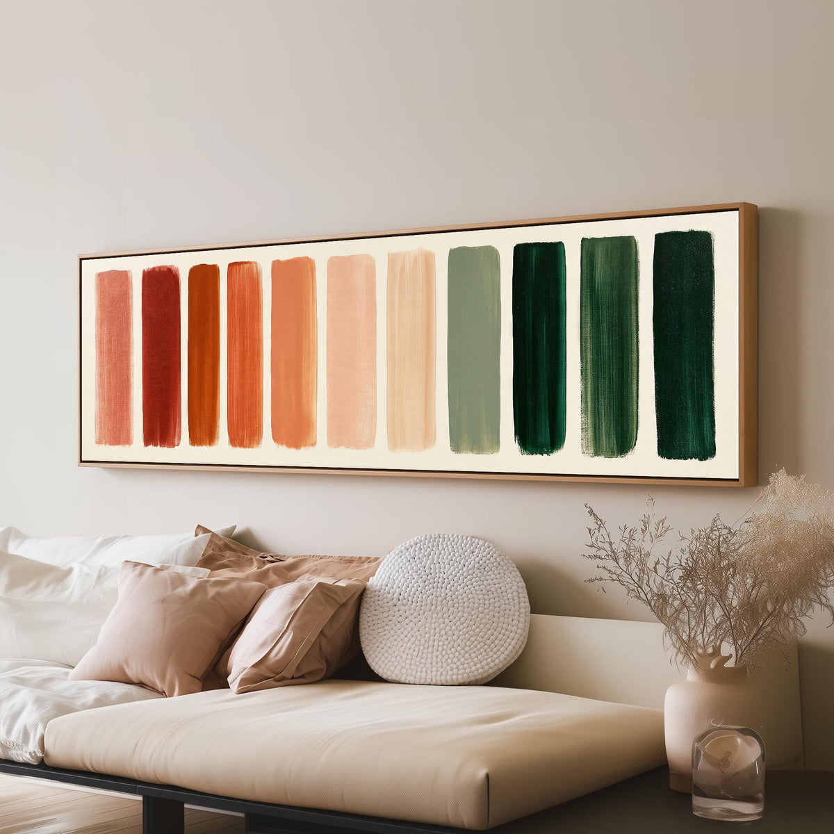 Brushed swatches from terracotta to forest green panoramic canvas print above a sofa in a living room