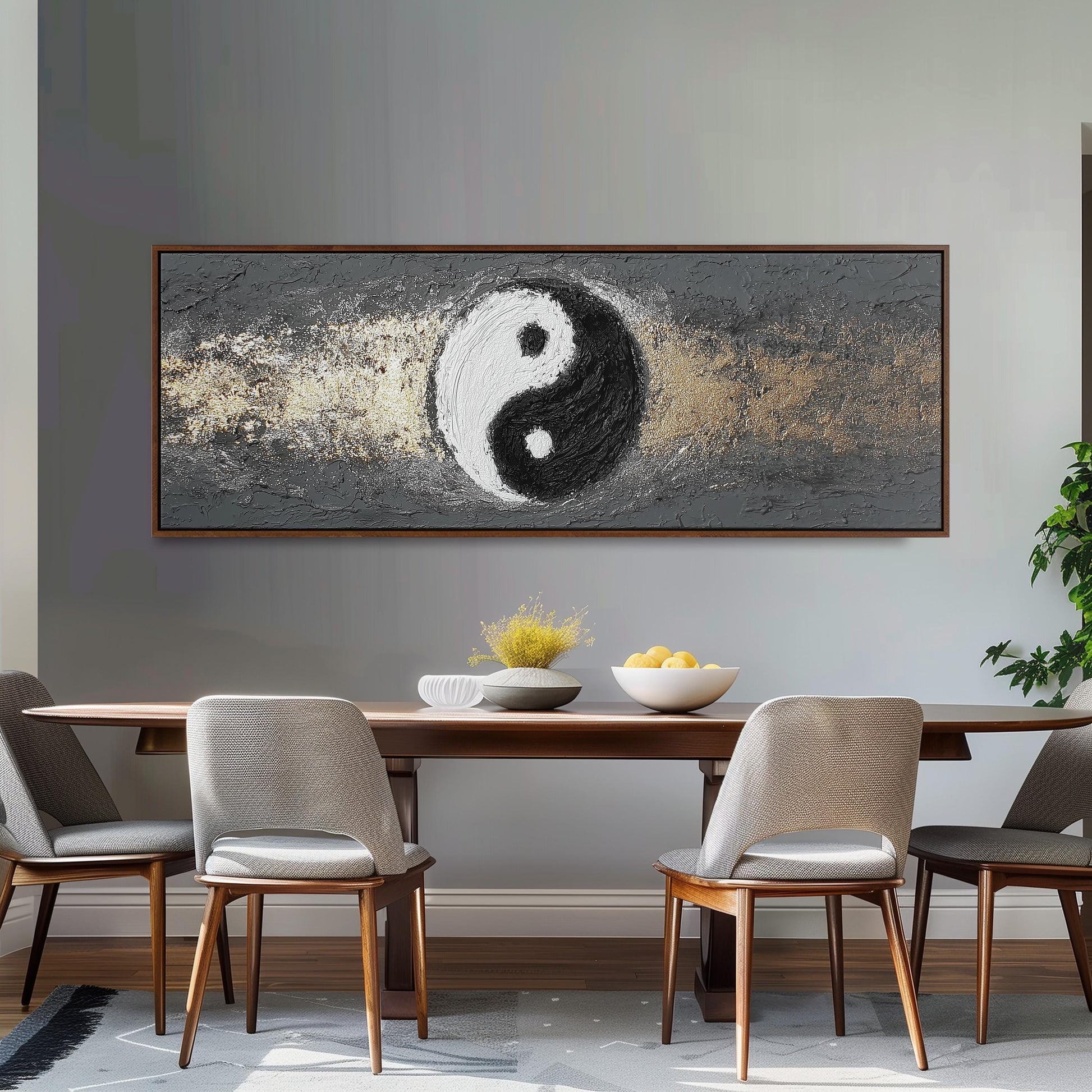 a dining room with a large painting of a yin and yang symbol hanging on the wall above a wooden dining table with four chairs. The table is set with a bowl of fruit and a vase of flowers, creating a cozy and inviting atmosphere.