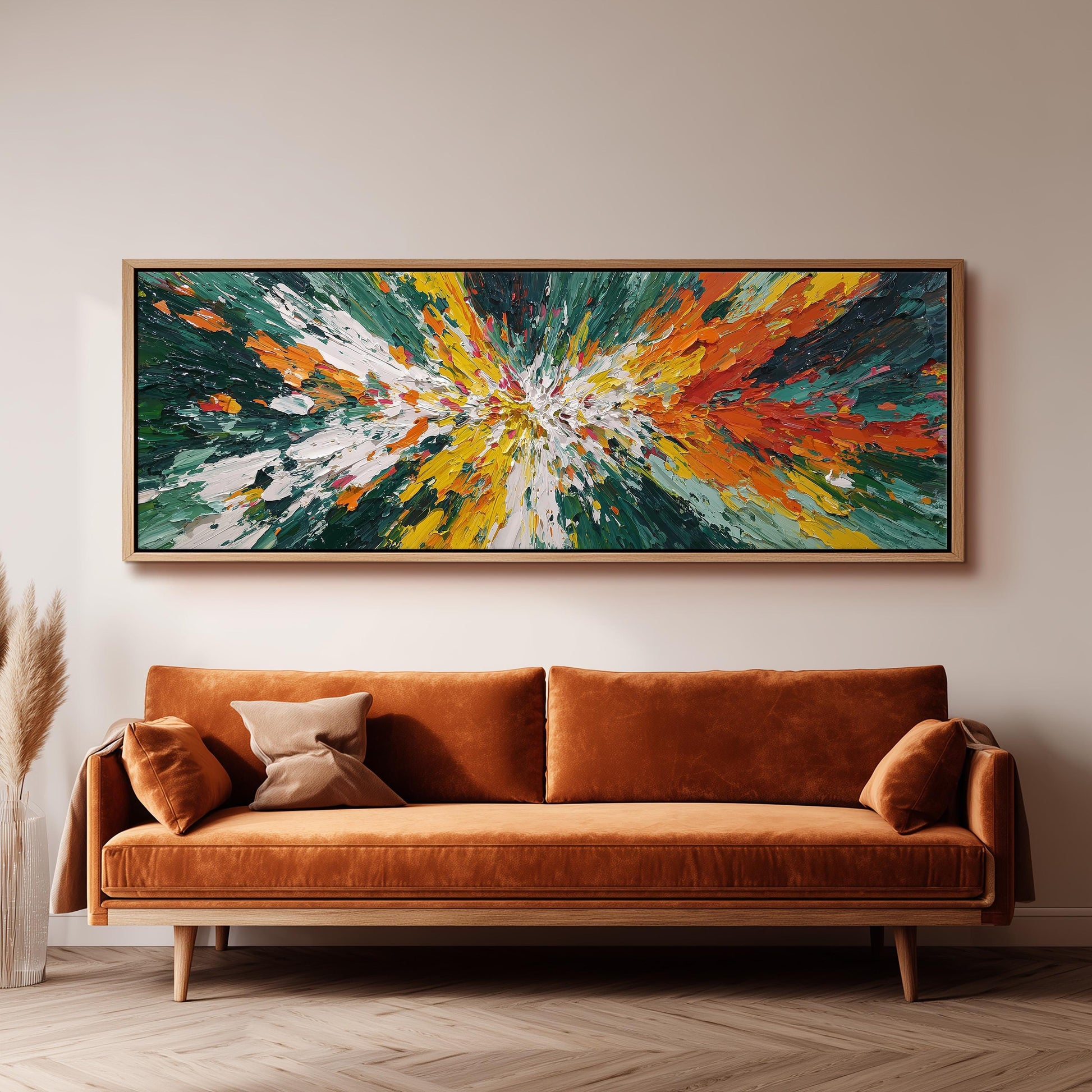 a large, vibrant abstract painting hanging on a wall above a brown sofa with two pillows.