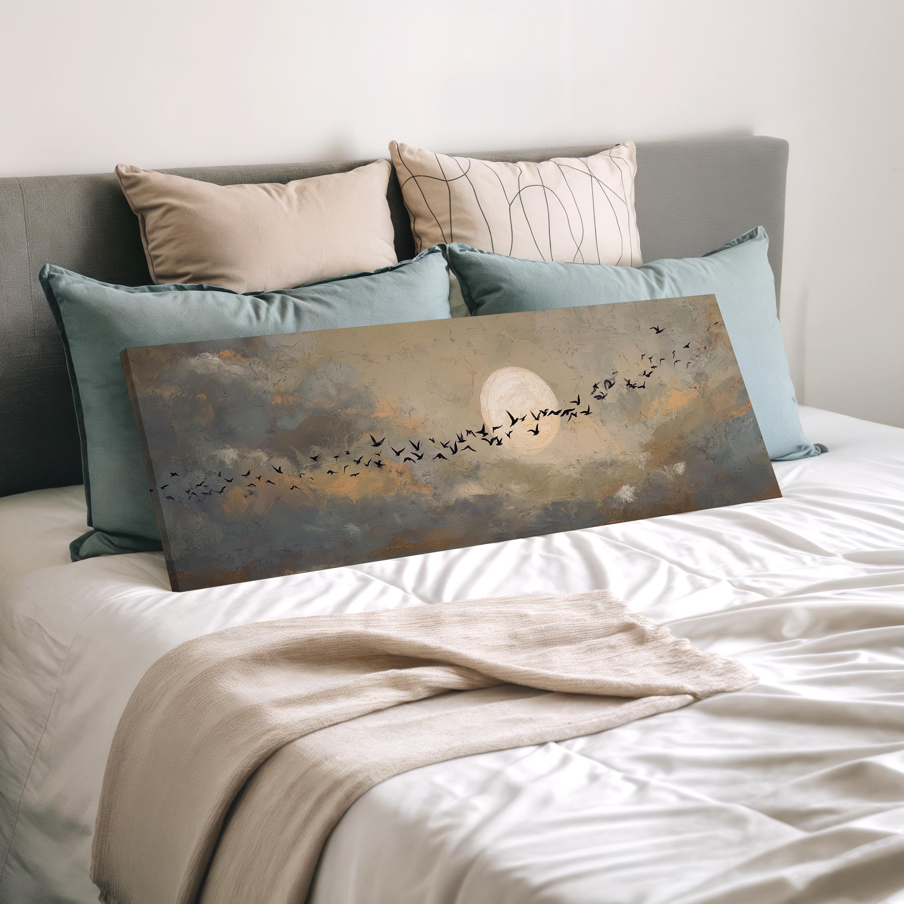 a bedroom with a bed and a painting of a flock of birds against a cloudy sky.