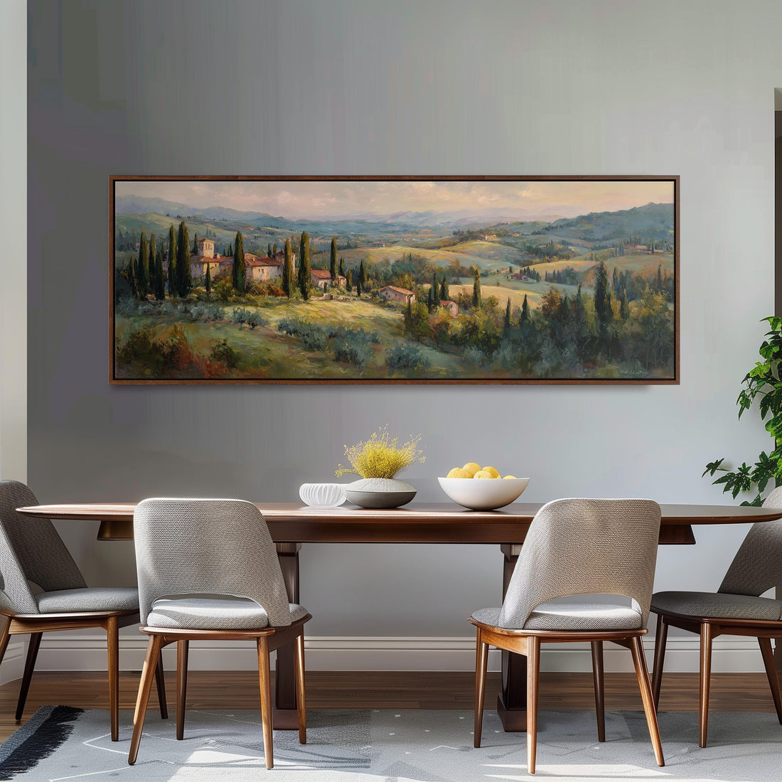 a large painting of a countryside landscape hanging on a wall above a black and white checkered sofa with a brown throw pillow.