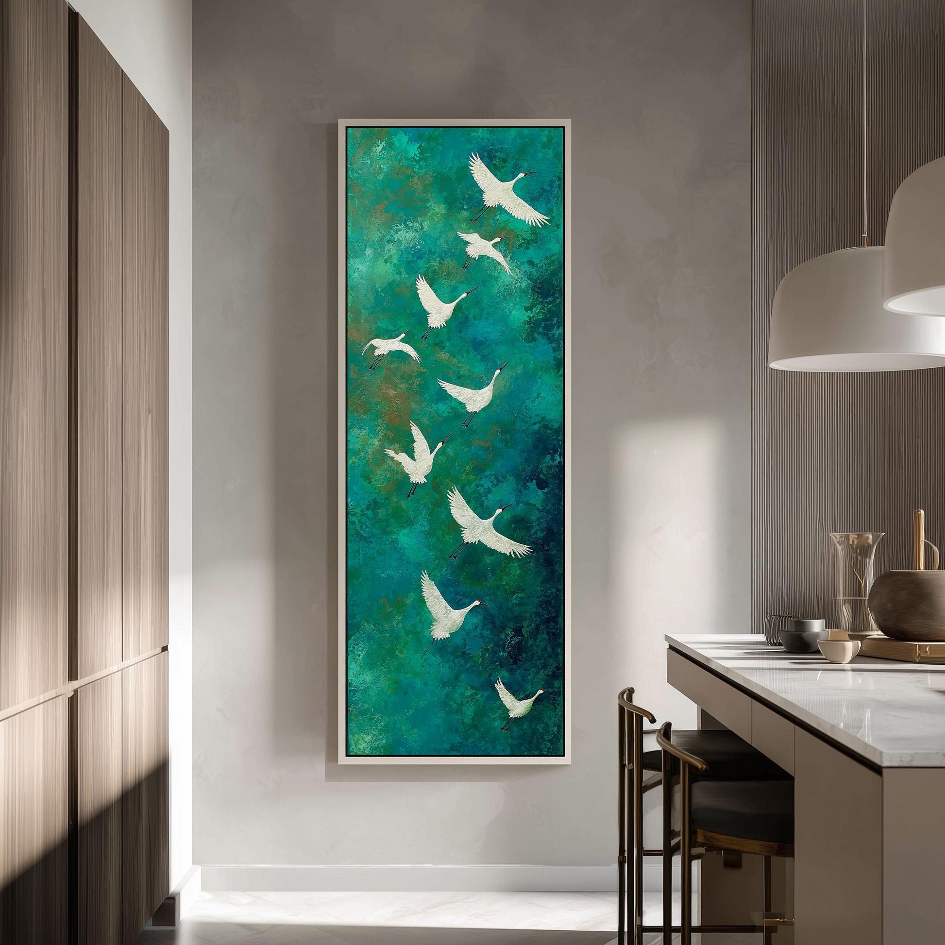 a large painting of white birds against a green background, hanging on a wall in a modern kitchen.