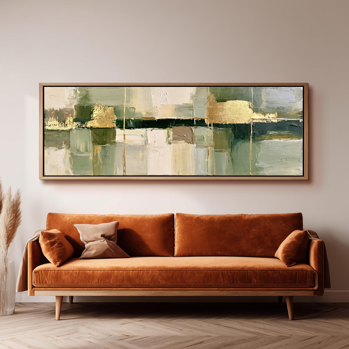 Sage and gold leaf abstract wide panoramic canvas print above a bench in a dark living room