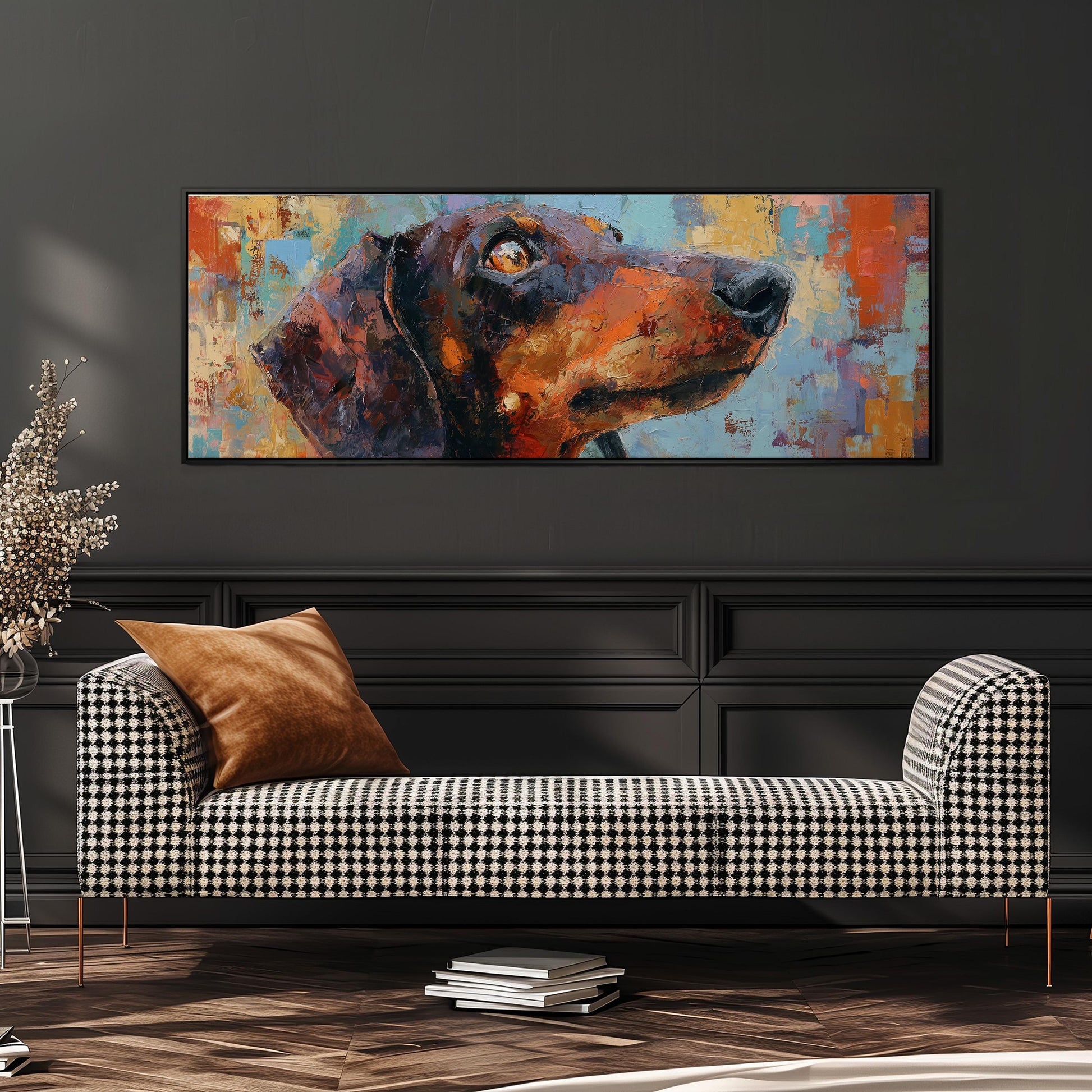 a large, colorful painting of a dog's head hanging on a wall above a black and white checkered sofa.