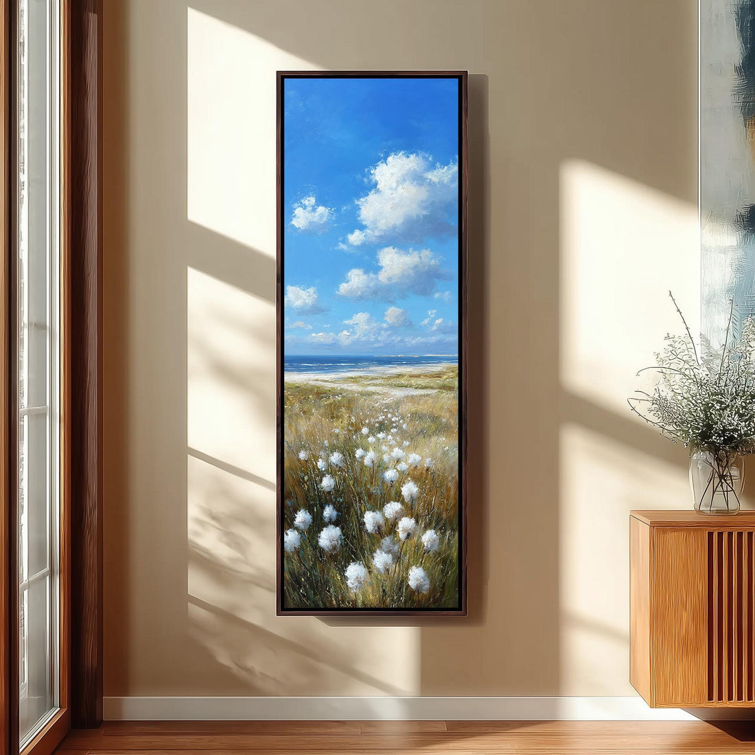 a large painting of a field with white flowers hanging on a wall in a modern kitchen.