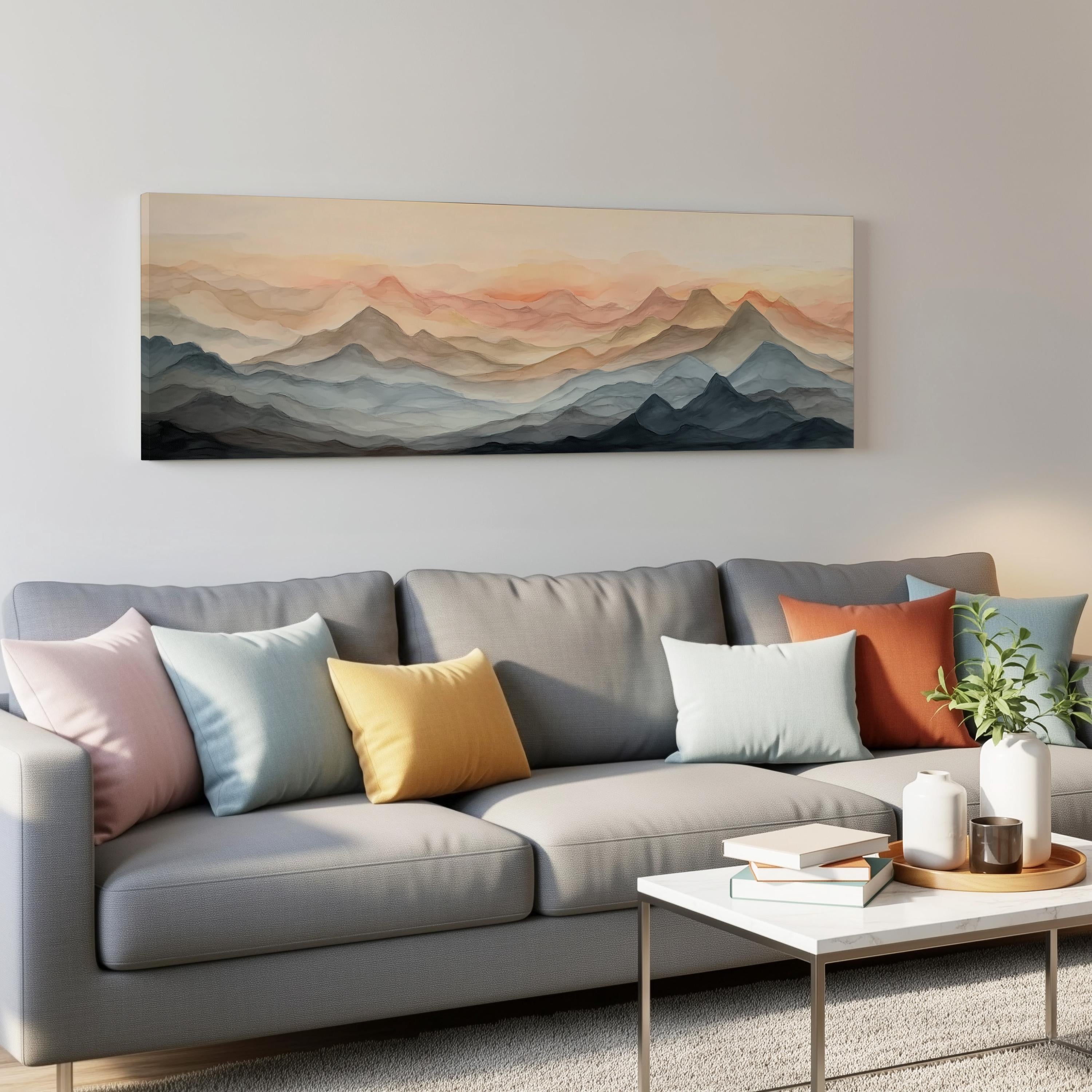 a gray couch with colorful throw pillows, a white coffee table, and a large landscape painting hanging on the wall above the couch.