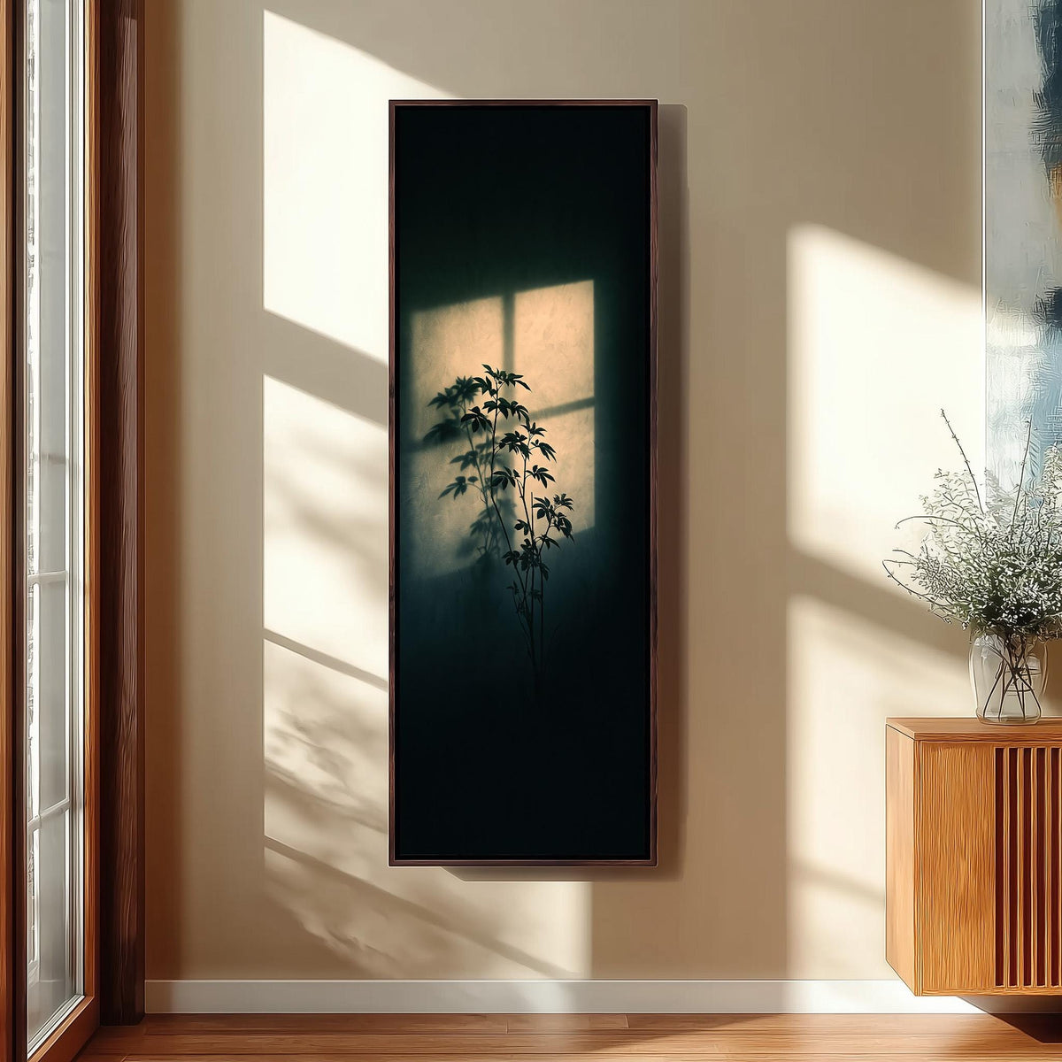 Plant silhouette in a beam of window light tall narrow canvas print beside a staircase in an entryway