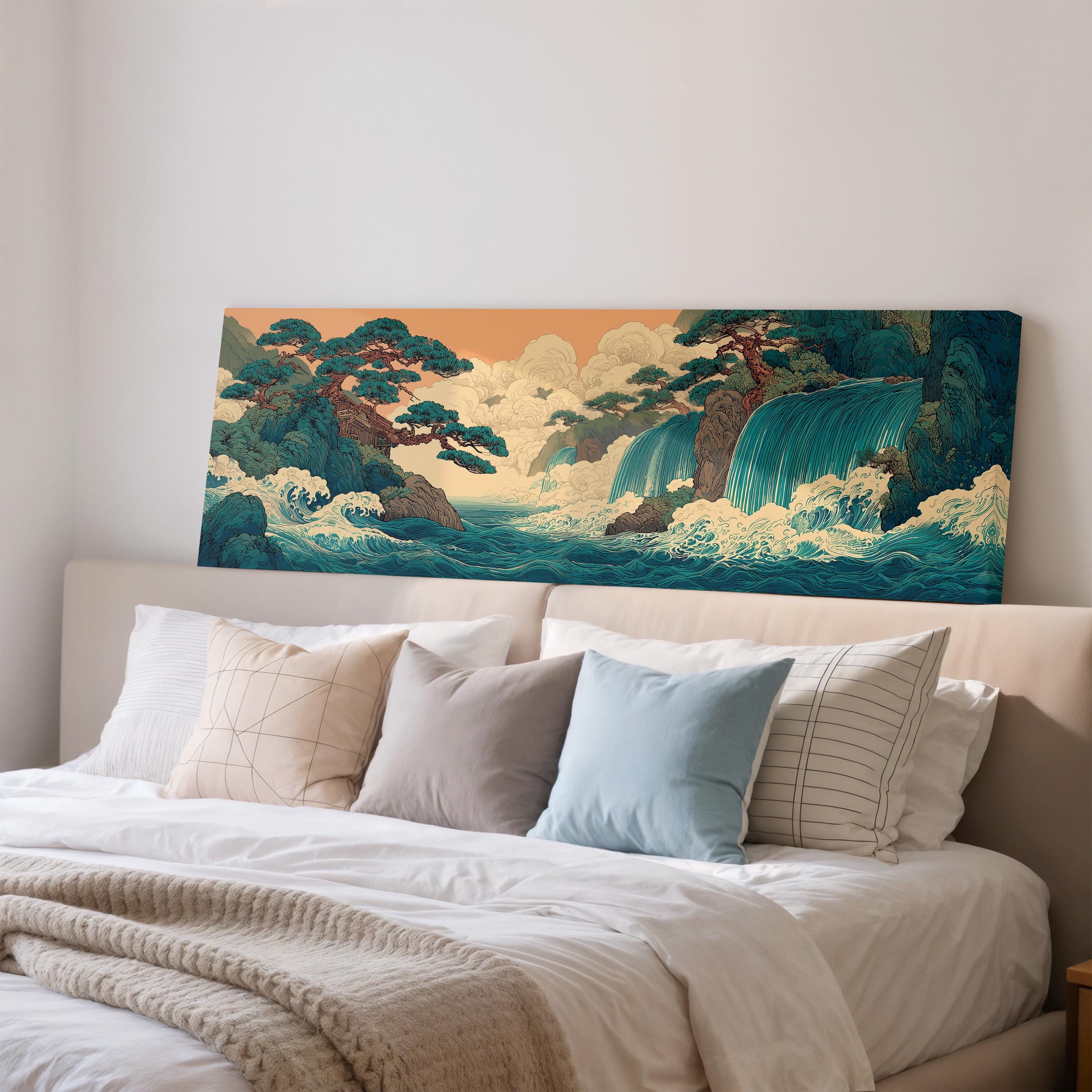 a large, colorful painting of a landscape with a waterfall and trees, hanging on the wall above a bed with white pillows and a gray blanket.