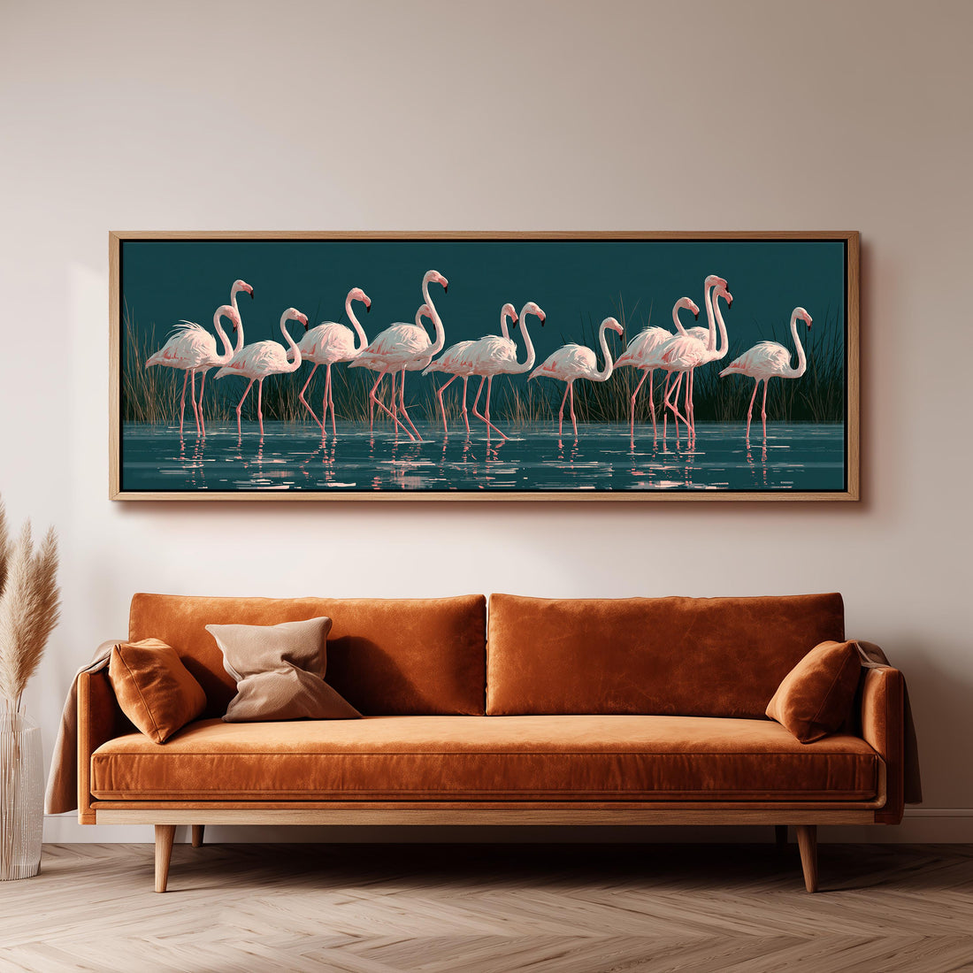 Blush pink flamingos on dark teal water long horizontal canvas print above a sofa in a living room