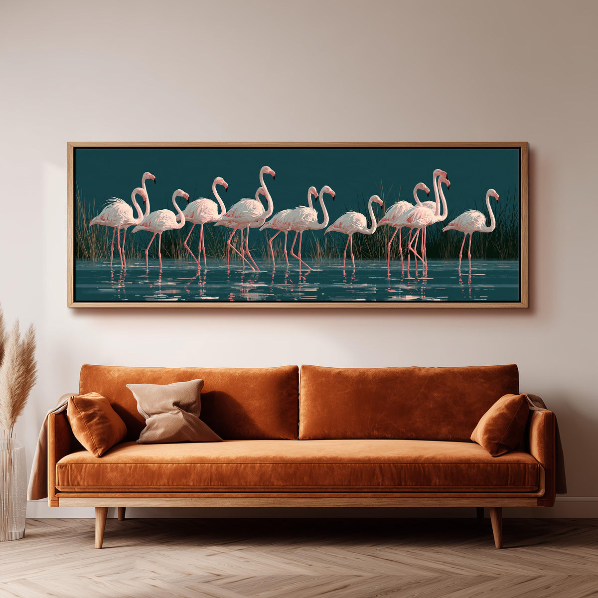 Blush pink flamingos on dark teal water long horizontal canvas print above a sofa in a living room