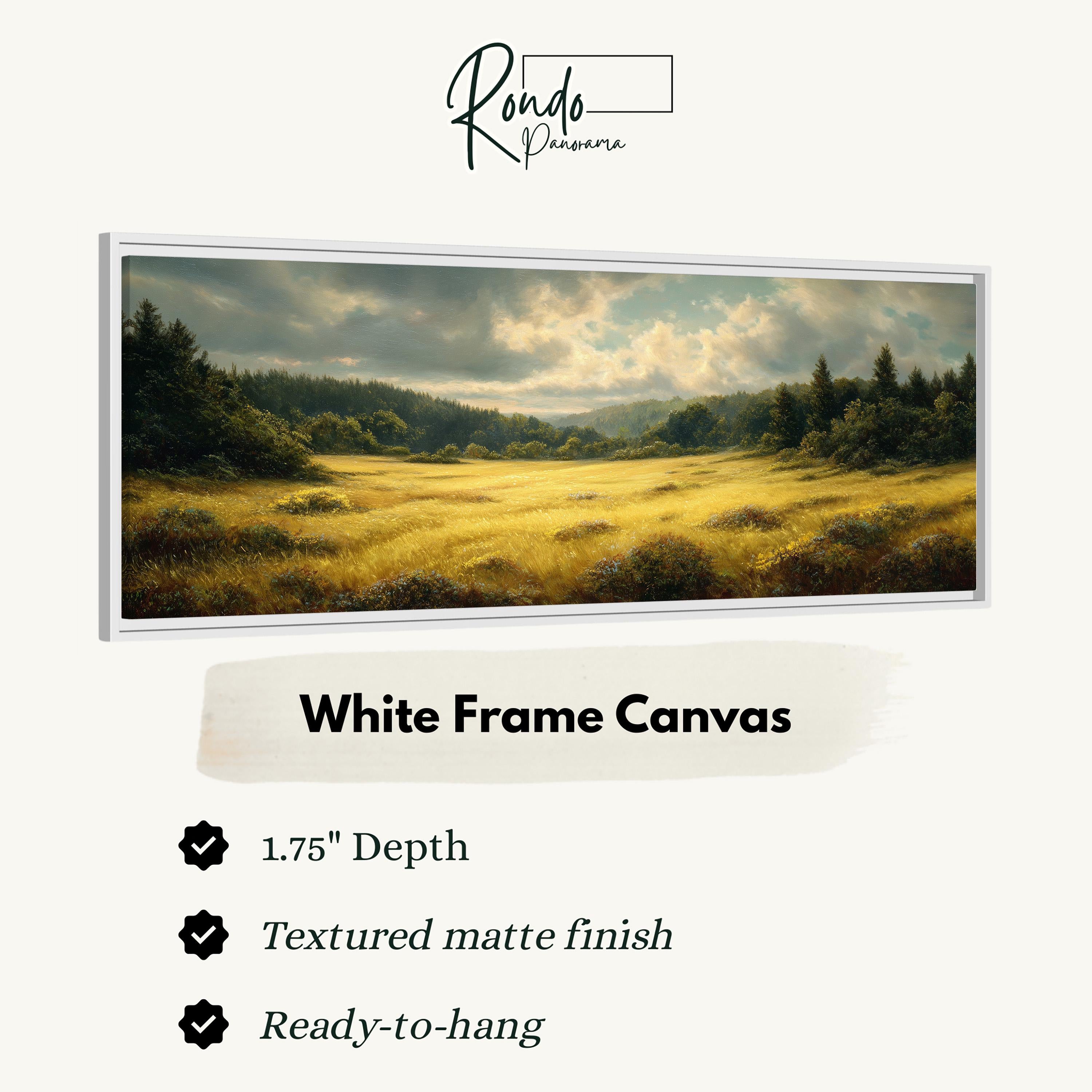 The image is a white frame canvas depicting a serene landscape with a field of tall grass and trees under a cloudy sky.