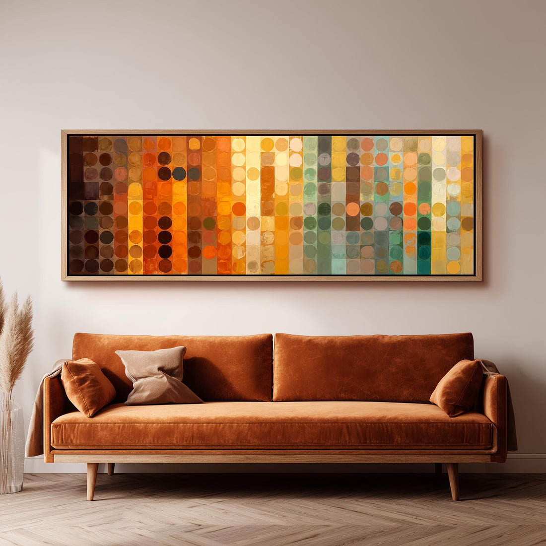 a large, colorful abstract painting hanging on a wall above a brown sofa in a living room setting.