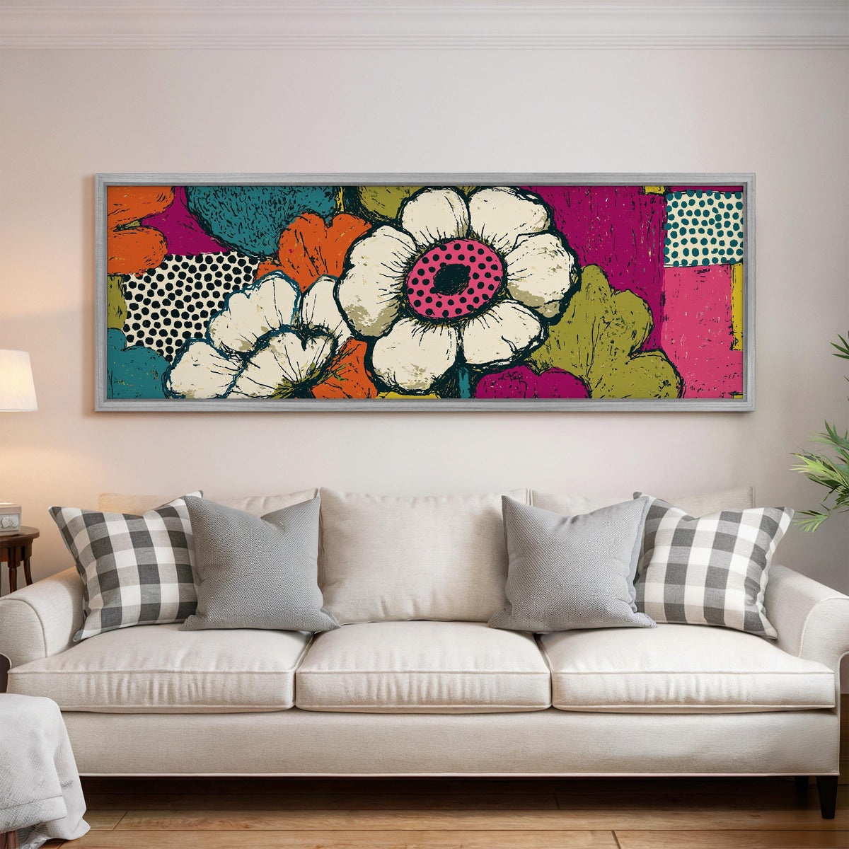 Bold pop blossoms panoramic canvas print above a white sofa in a bright living room