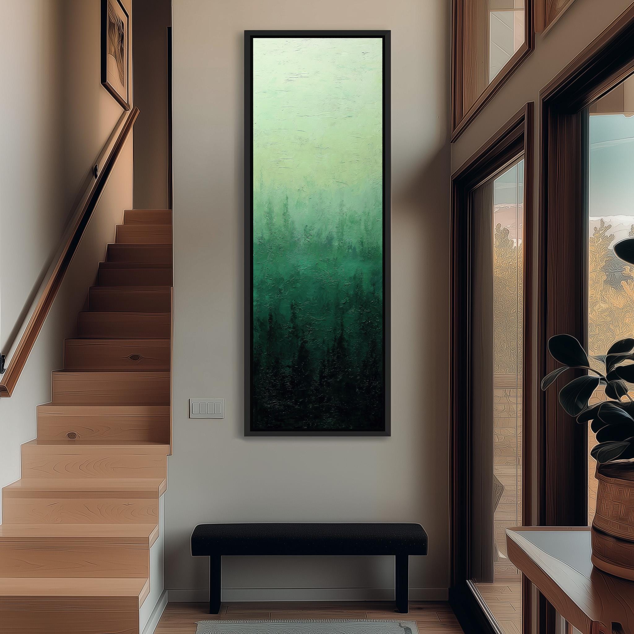 a hallway with a large painting of a forest scene hanging on the wall. The painting is framed in black and is positioned above a bench. The hallway has wooden stairs leading up to the painting, and there is a window on the right side of the image.