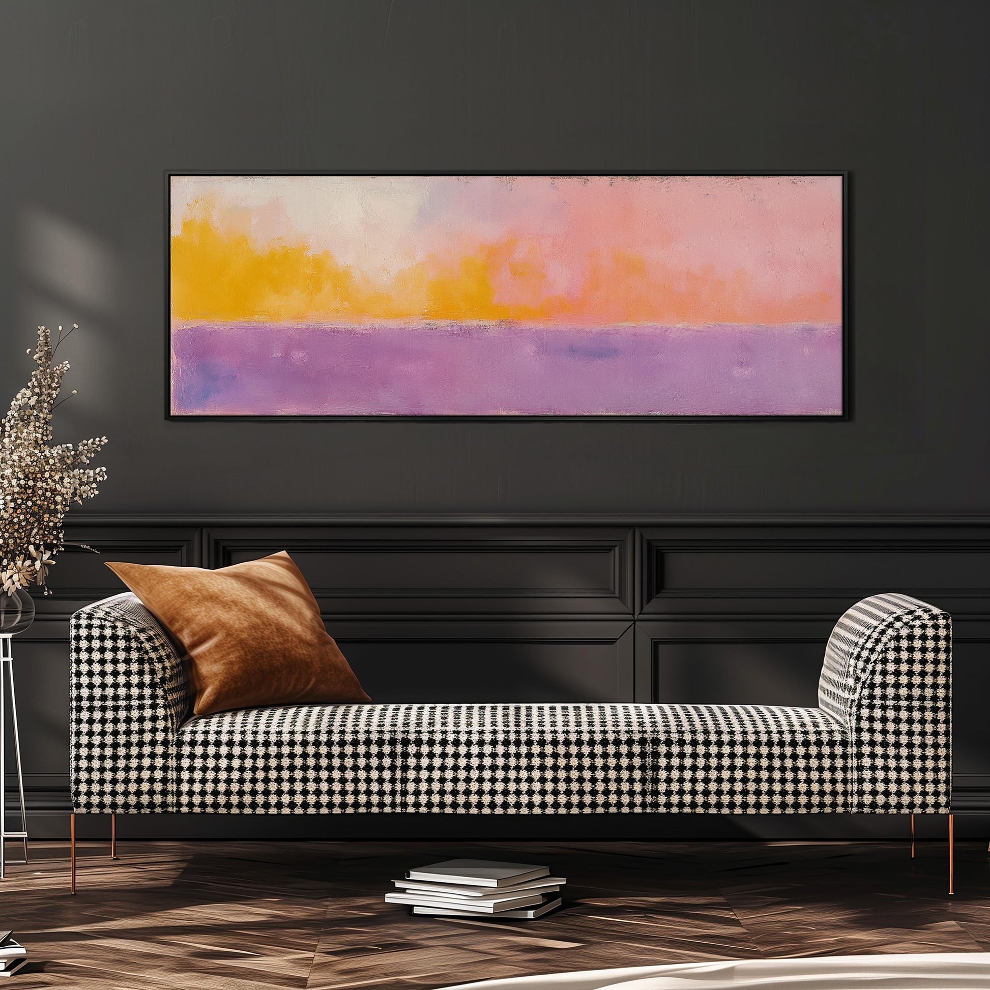 a checkered sofa with a brown throw pillow, set against a dark wall with a large abstract painting hanging above it.