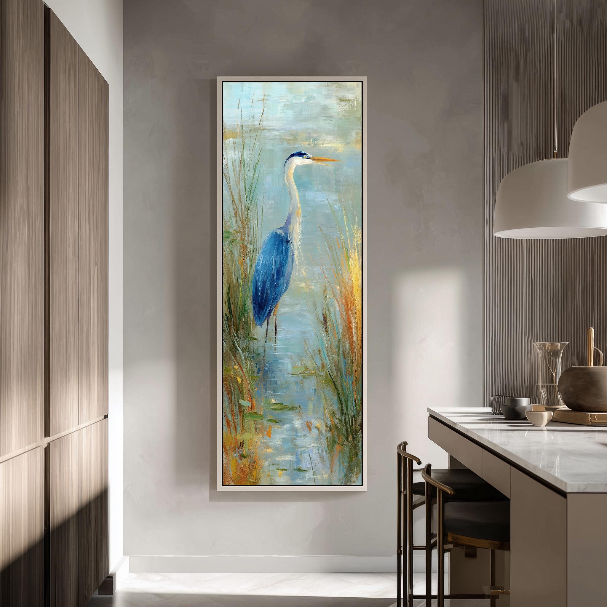 a large painting of a blue heron standing in a grassy area, hanging on a wall in a modern kitchen.