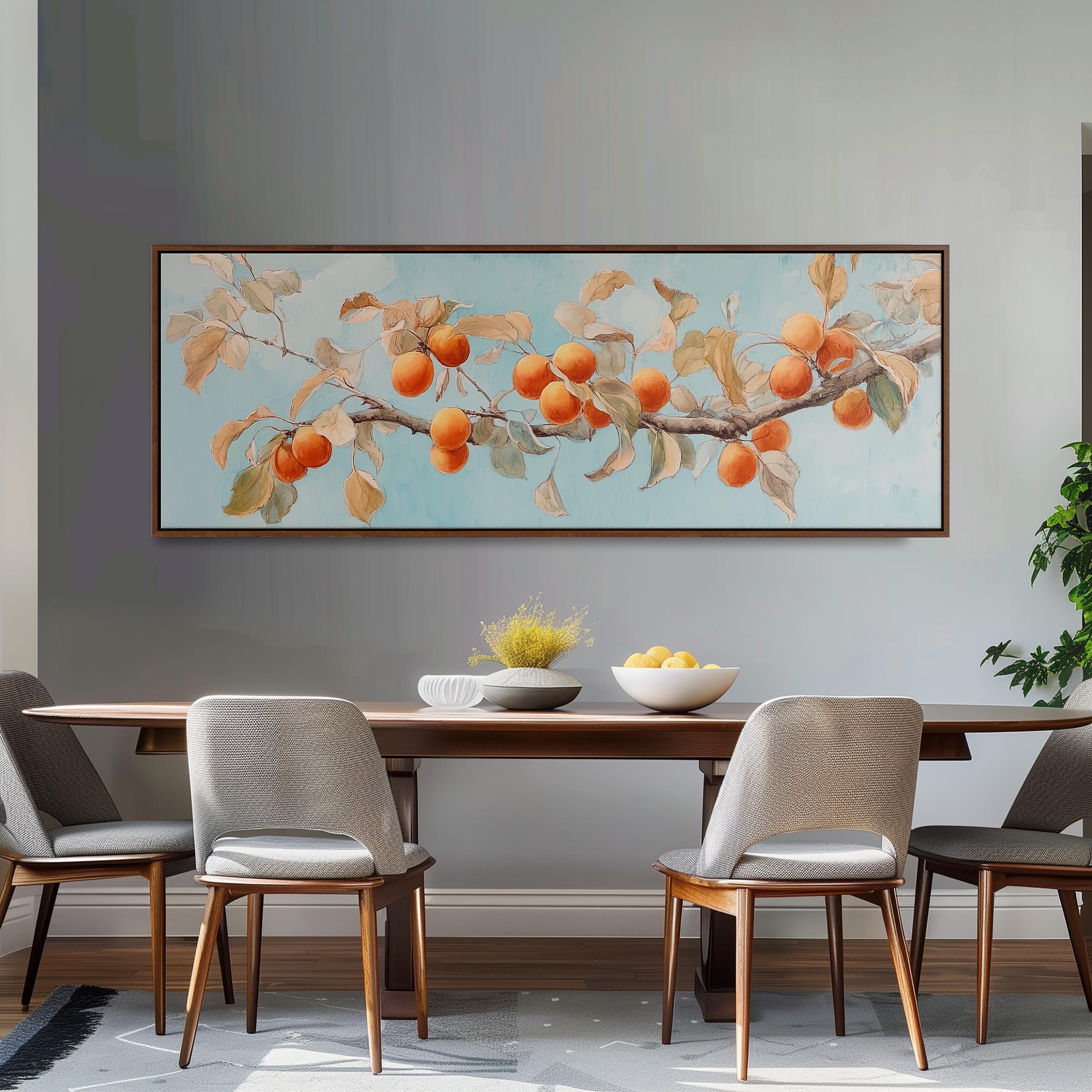 a dining room with a large painting of a tree branch with oranges hanging from it, a wooden table with a bowl of fruit, and four chairs around the table.