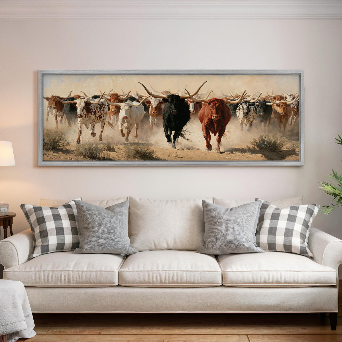 Longhorn cattle stampede panoramic canvas print above a white sofa in a bright living room