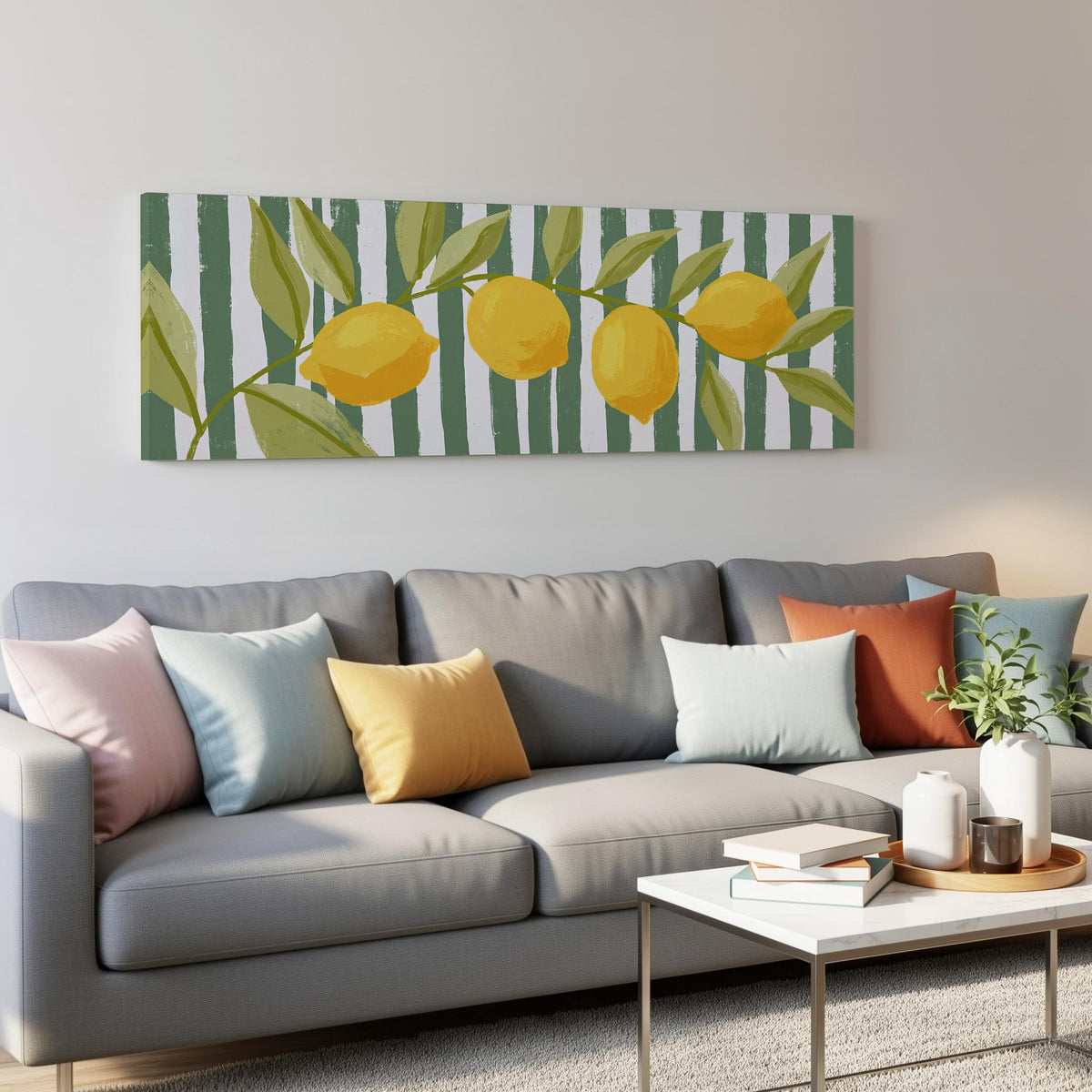 Lemon branch on green stripes panoramic canvas print above a grey sofa in a living room