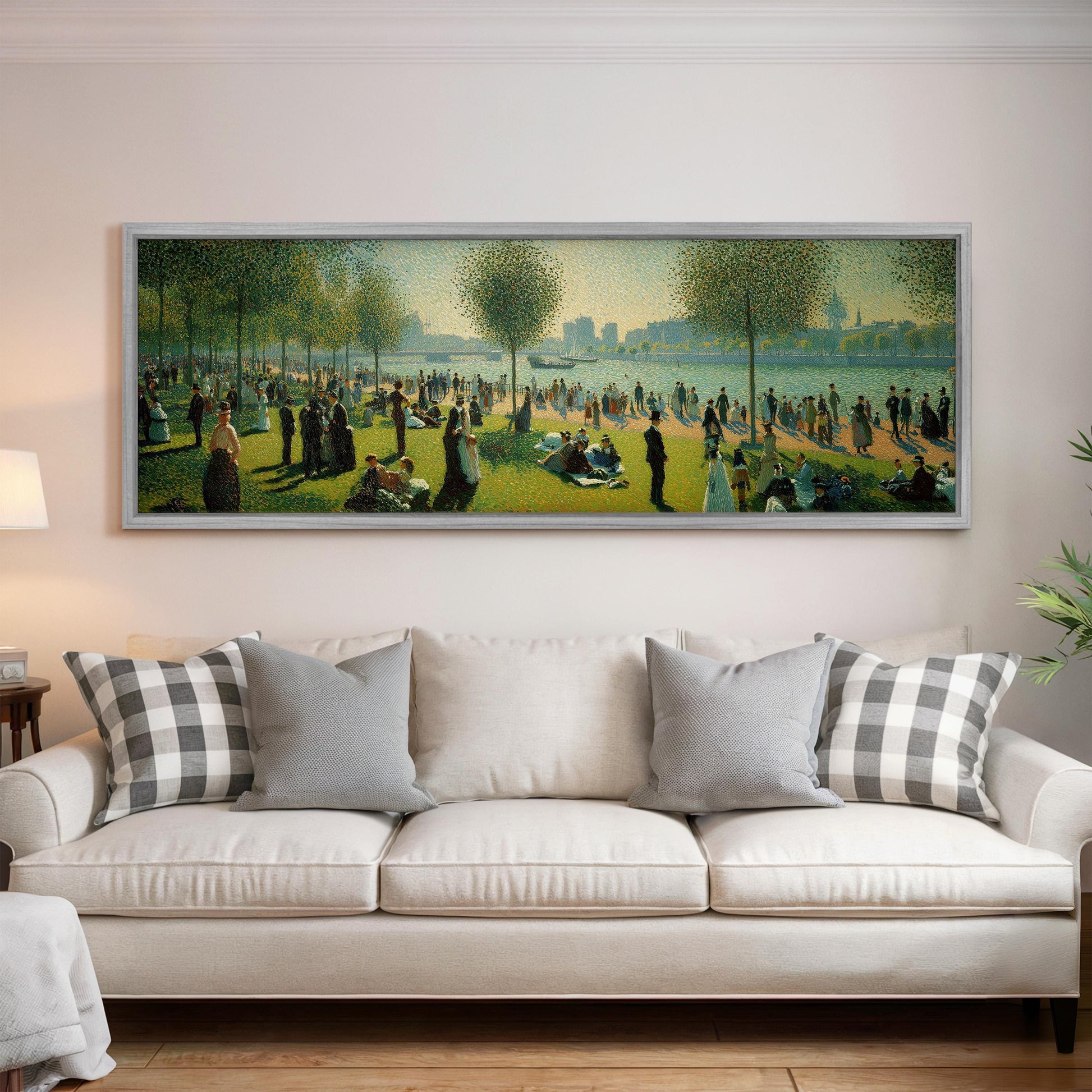 a large painting of a park scene hanging on a wall above a white sofa with decorative pillows.
