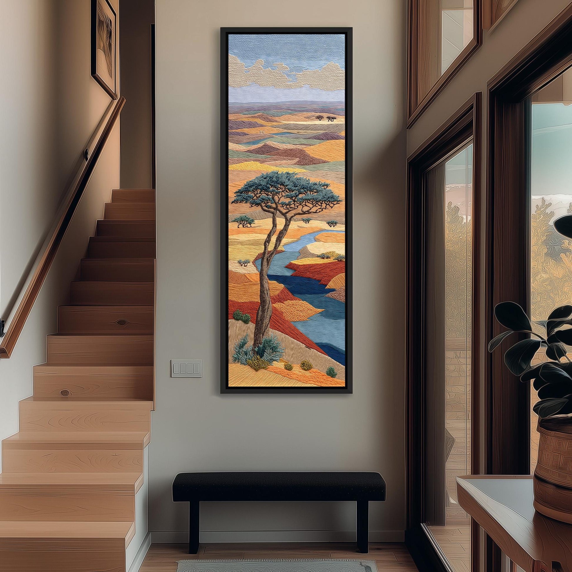 a large, colorful painting of a tree hanging on the wall of a hallway. The painting depicts a serene landscape with a tree in the foreground and a river flowing through the background. The hallway has wooden stairs leading up to the painting, and there is a bench in the foreground. The overall atmosphere of the image is calm and peaceful, with the painting serving as a focal point in the space.