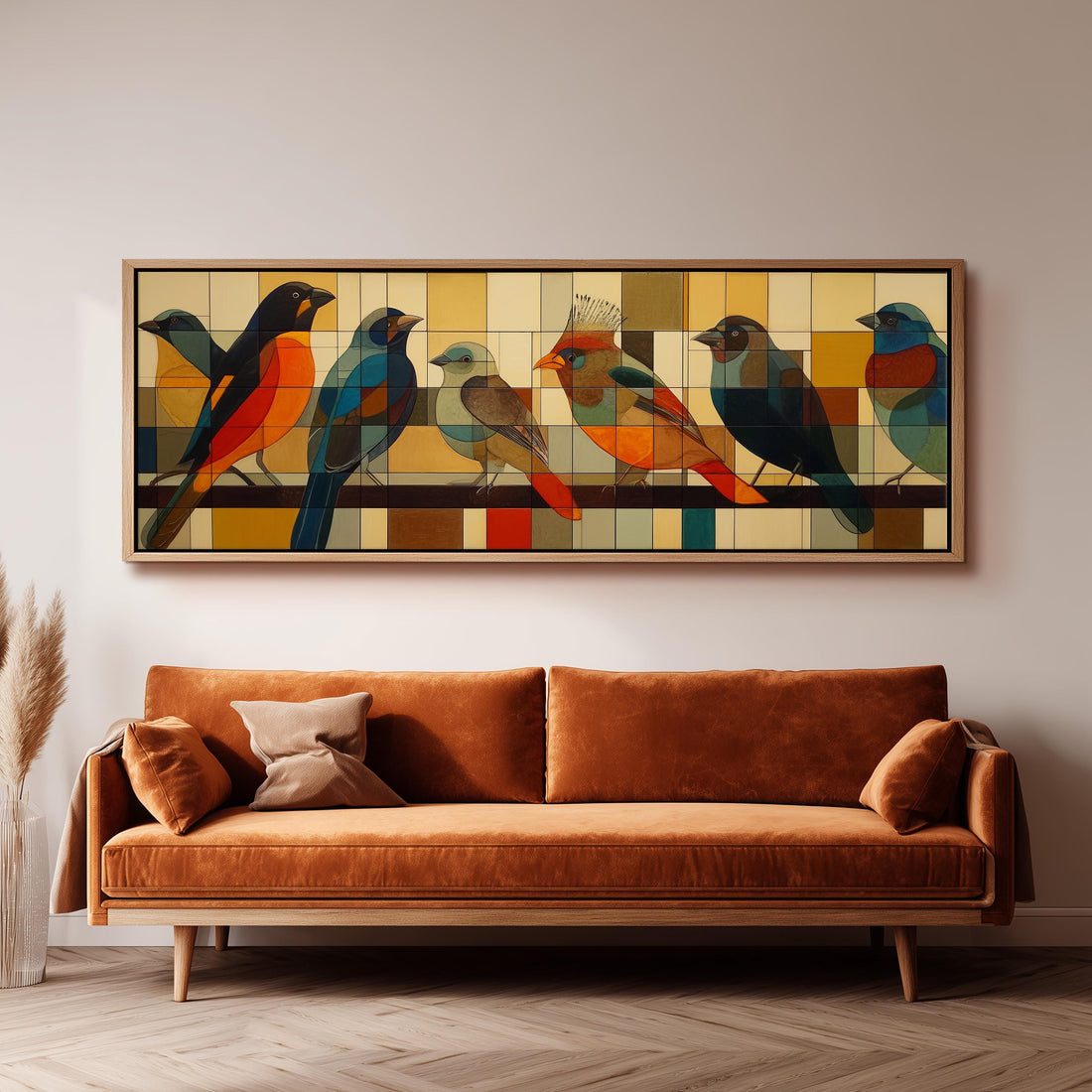 a large, colorful painting of birds displayed on a wall above a brown sofa.