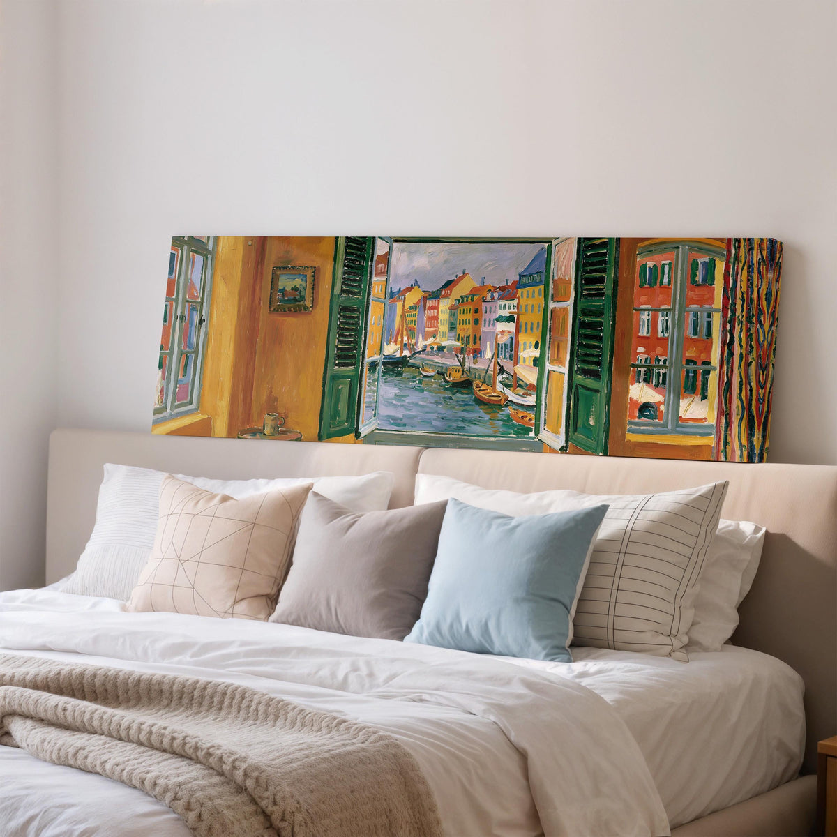 Copenhagen's colorful canal through a window wide panoramic canvas print above a bed in a bedroom