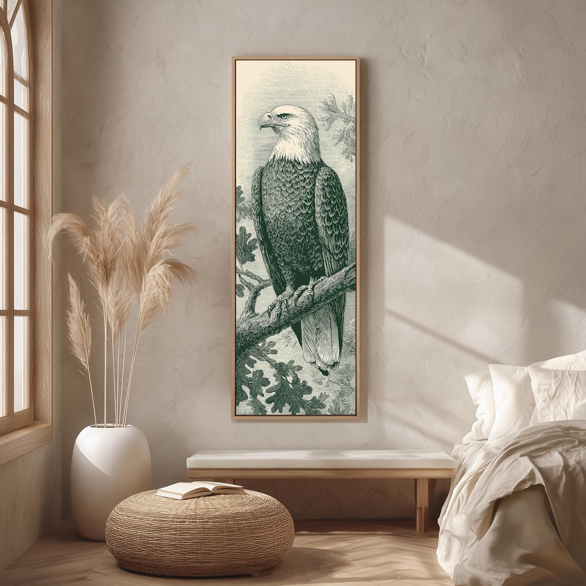a large framed picture of a bald eagle perched on a branch, hanging on a wall in a room with a wooden floor and a white bed in the background.