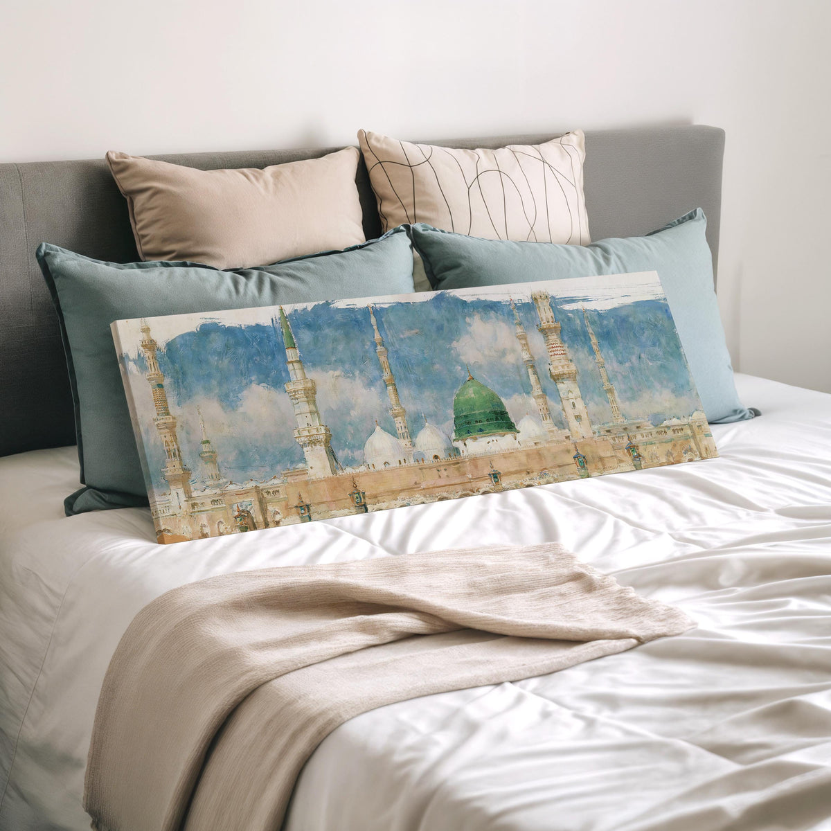 The green dome of the Prophet's Mosque in Medina wide panoramic canvas print laid on a bed to show its size