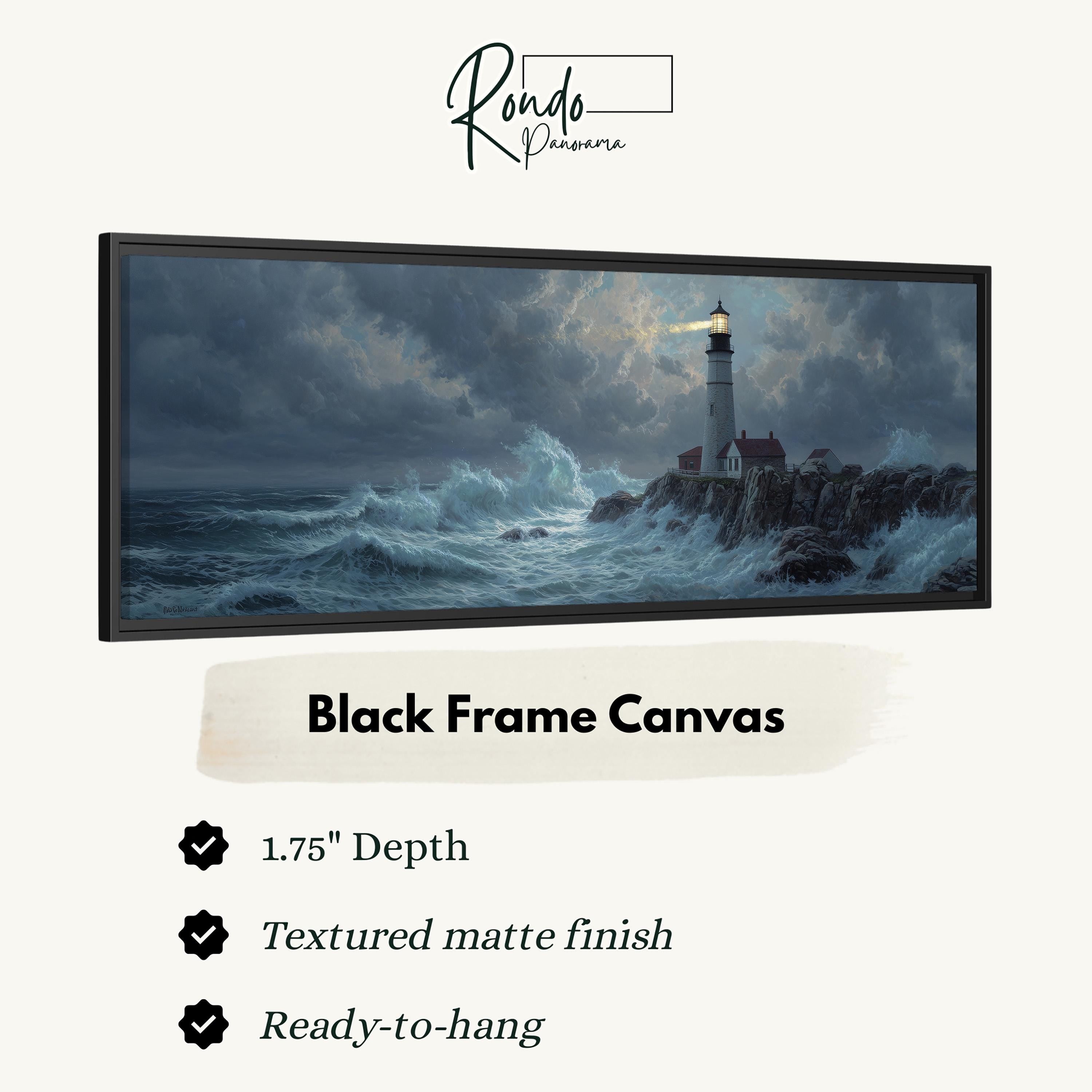 The image is a black frame canvas depicting a lighthouse on a rocky shore during a stormy sea.