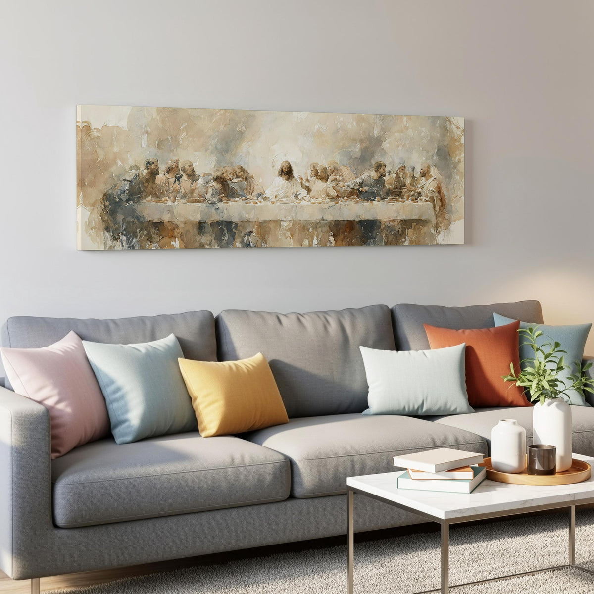 The Last Supper in soft gold tones panoramic canvas print above a grey sofa in a living room