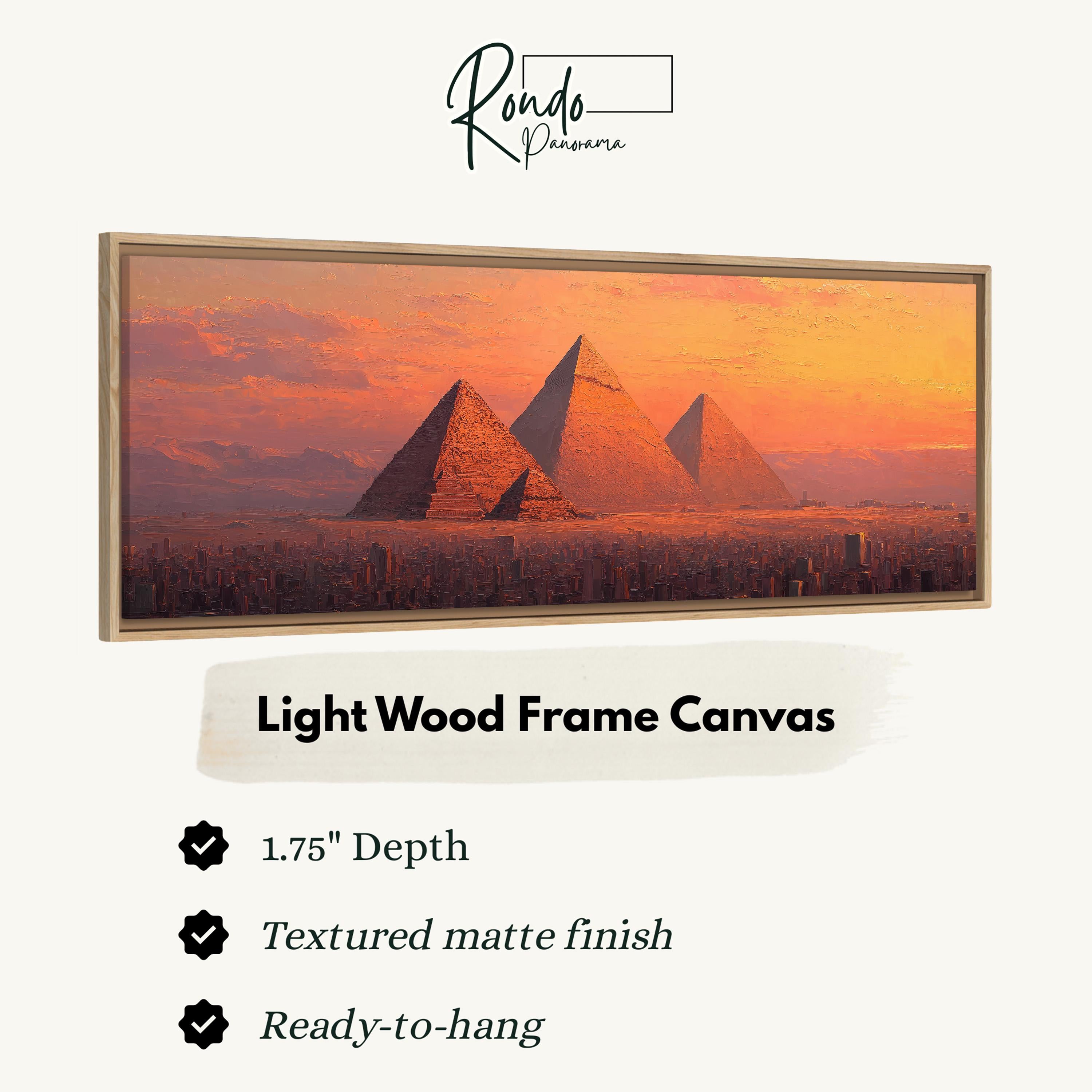 a large, light wood frame canvas depicting the iconic pyramids of Giza against a sunset sky.
