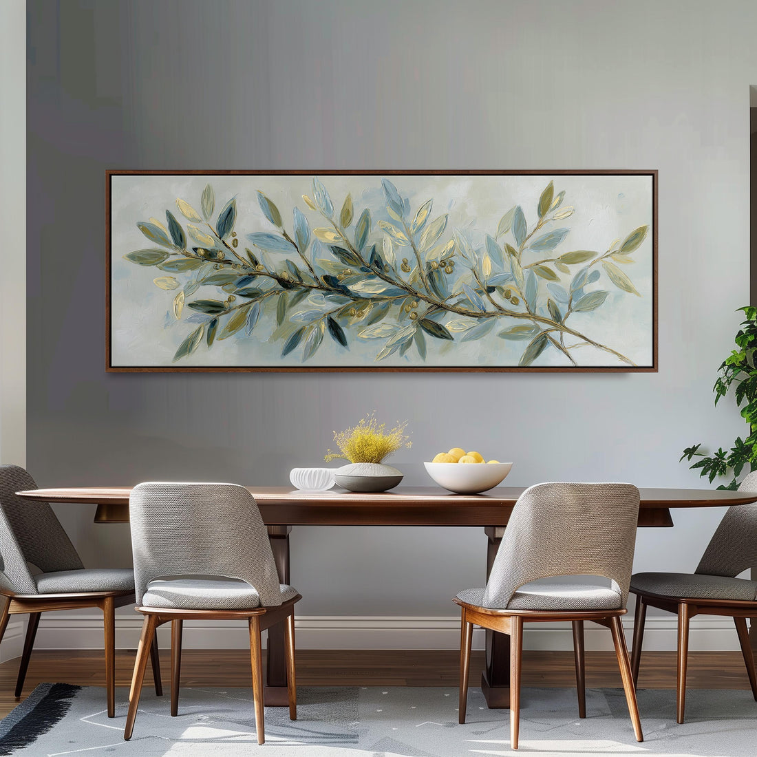a large, framed painting of a branch with green leaves and small white flowers hanging above a white couch with gray and white plaid throw pillows.