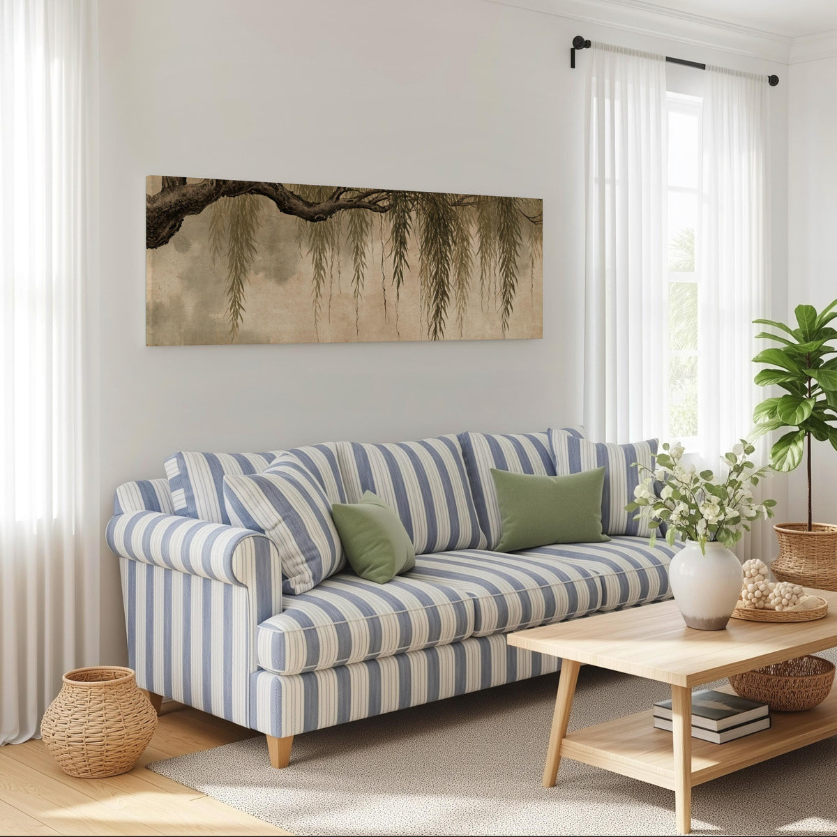 Hanging willow branches long horizontal canvas print above a striped sofa in a coastal living room
