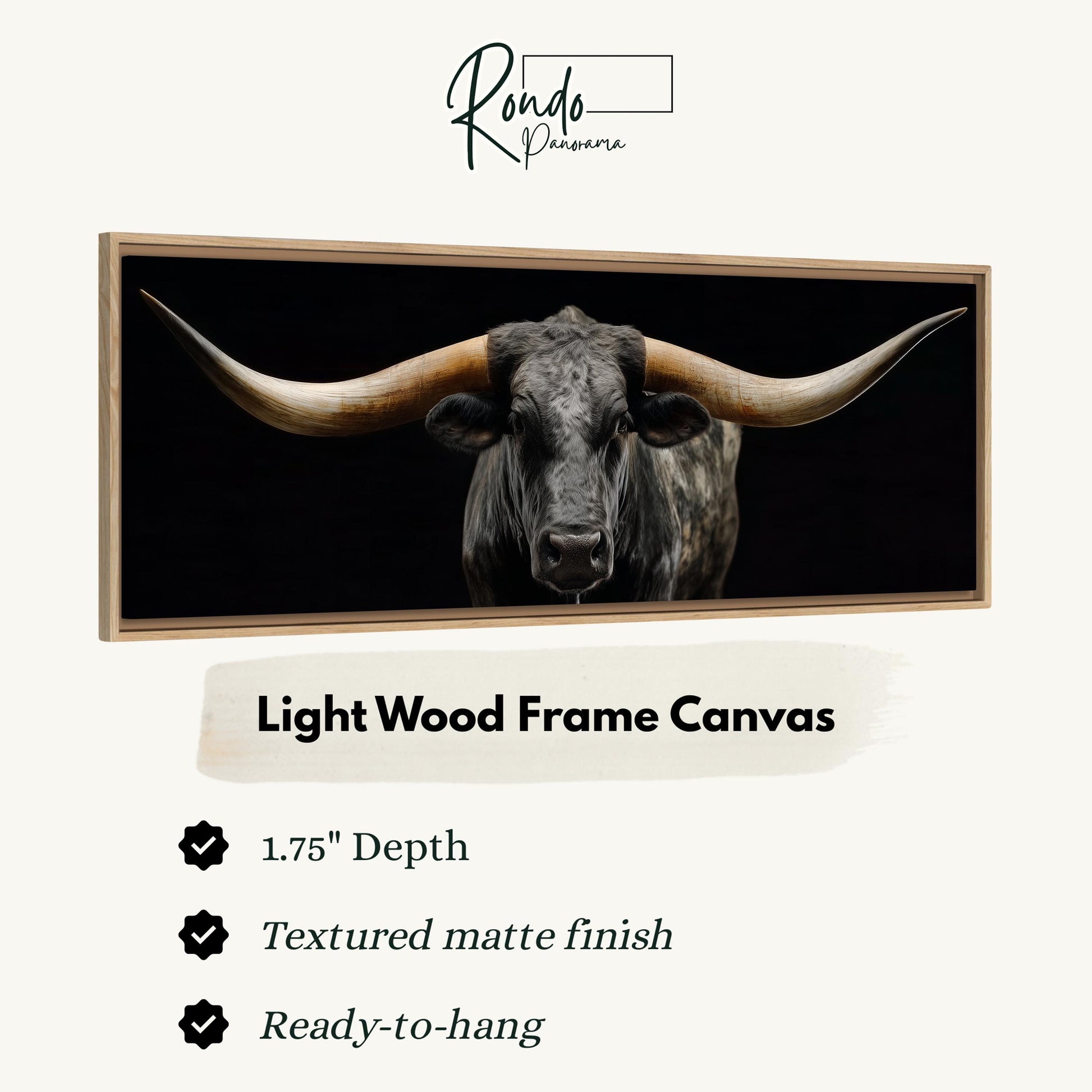 a close-up of a bull with large horns, displayed in a light wood frame canvas.