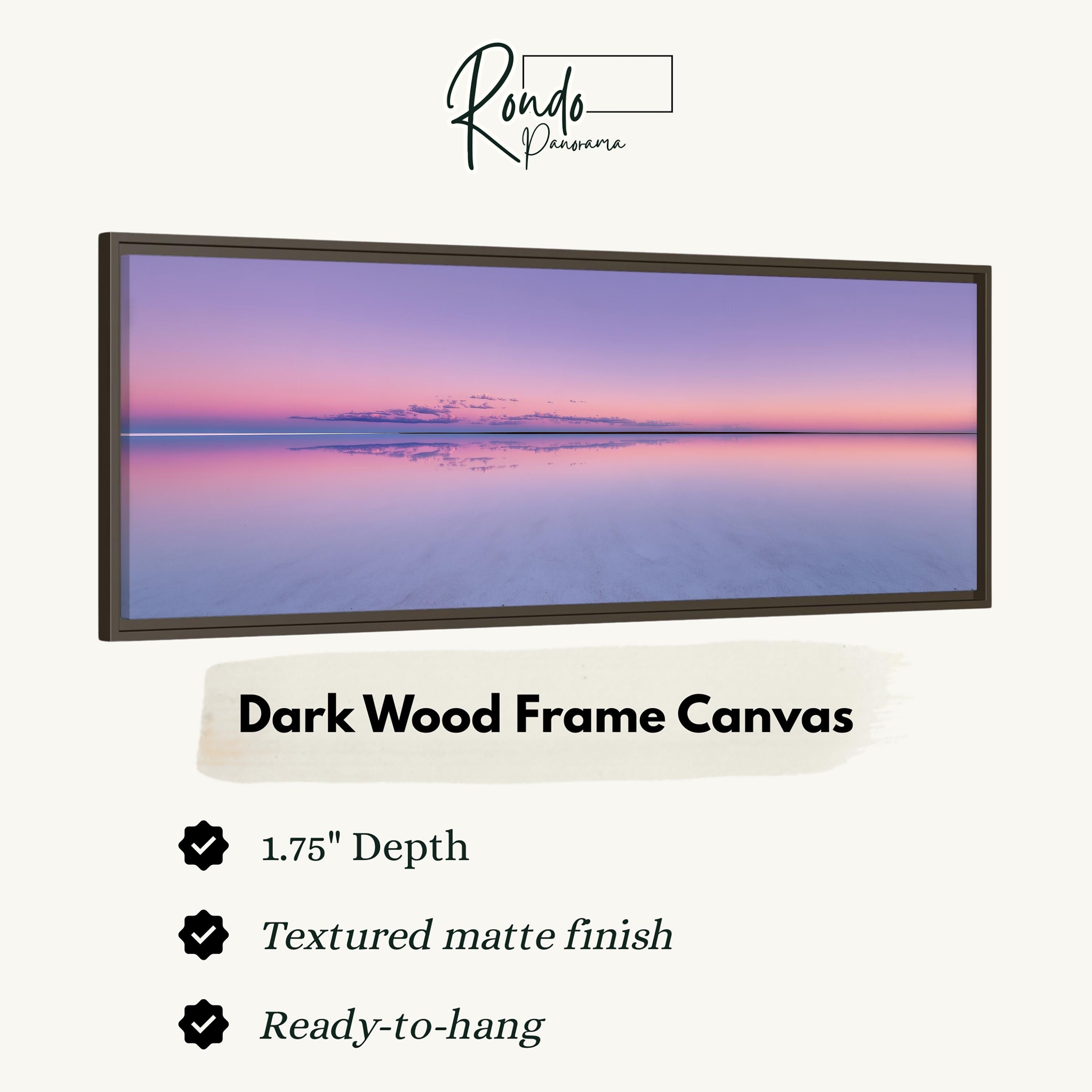 The image is a dark wood frame canvas depicting a serene sunset over a calm body of water.