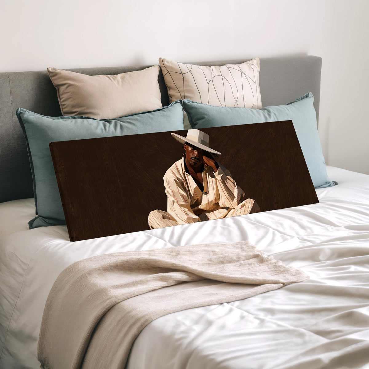 Pensive man in a white hat on brown wide panoramic canvas print laid on a bed to show its size
